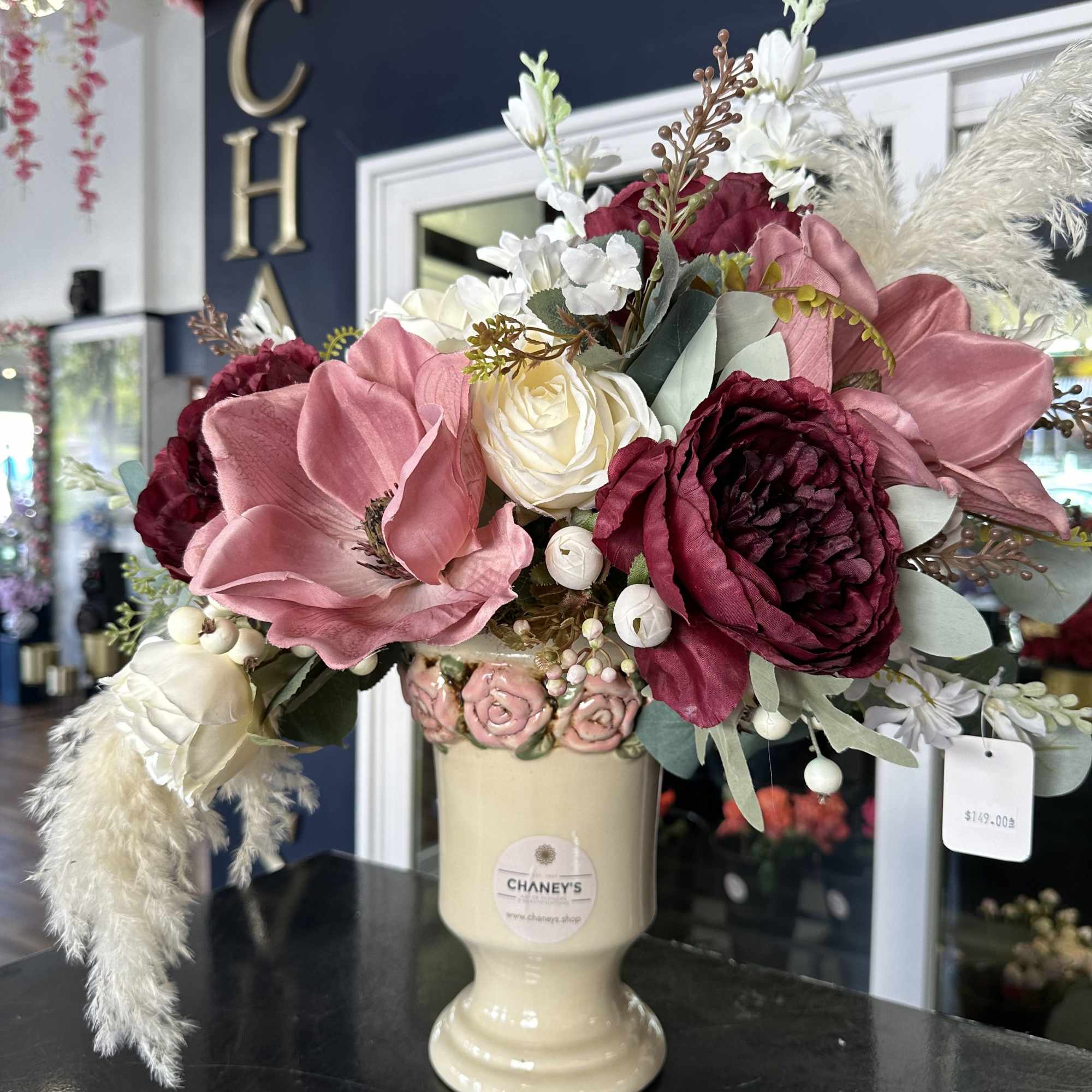 Unique piece! 25&quot; tall artificials hand arranged by our designers. Order before