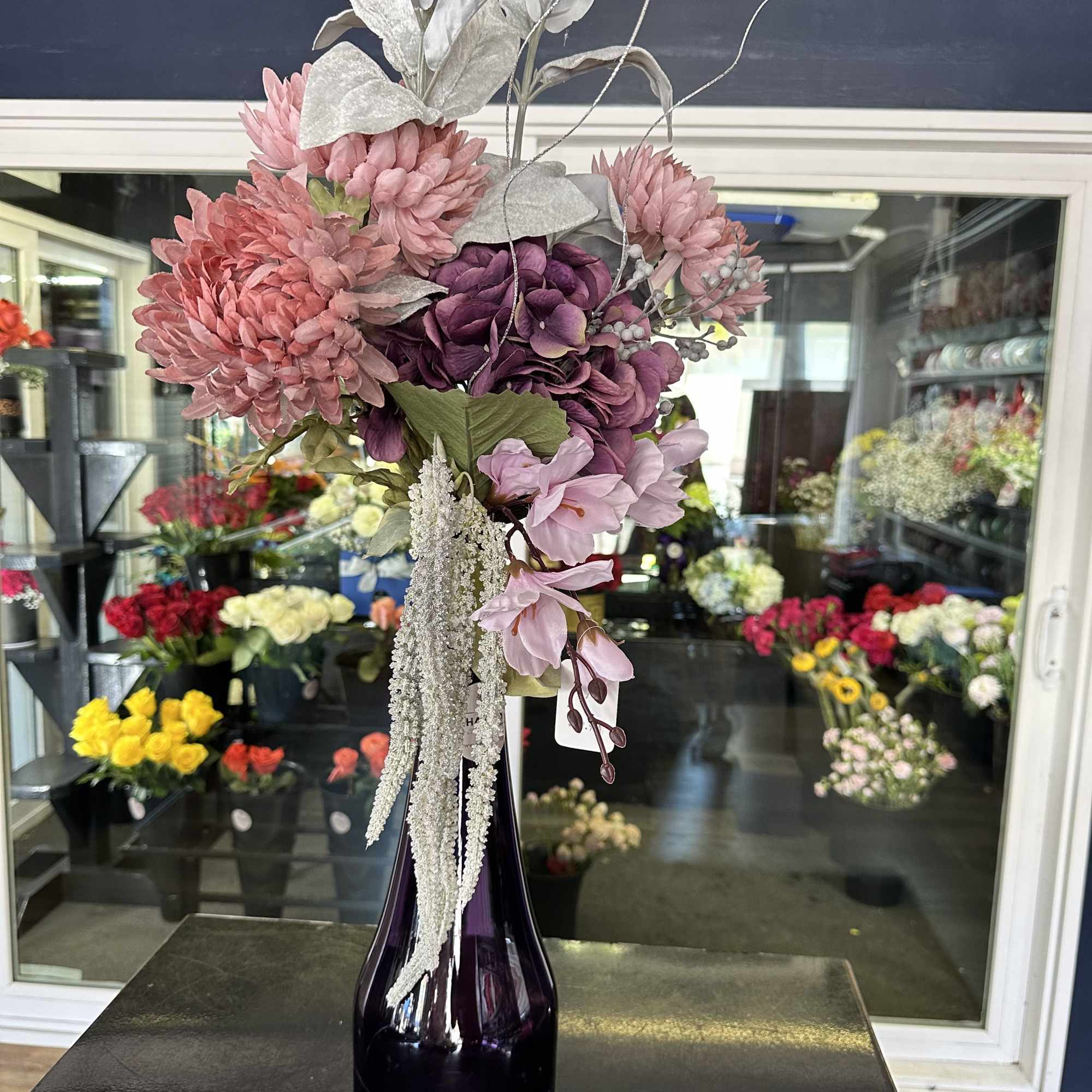 Unique piece! 31&ldquo; tall purple vase with purple and matching artificial flowers
