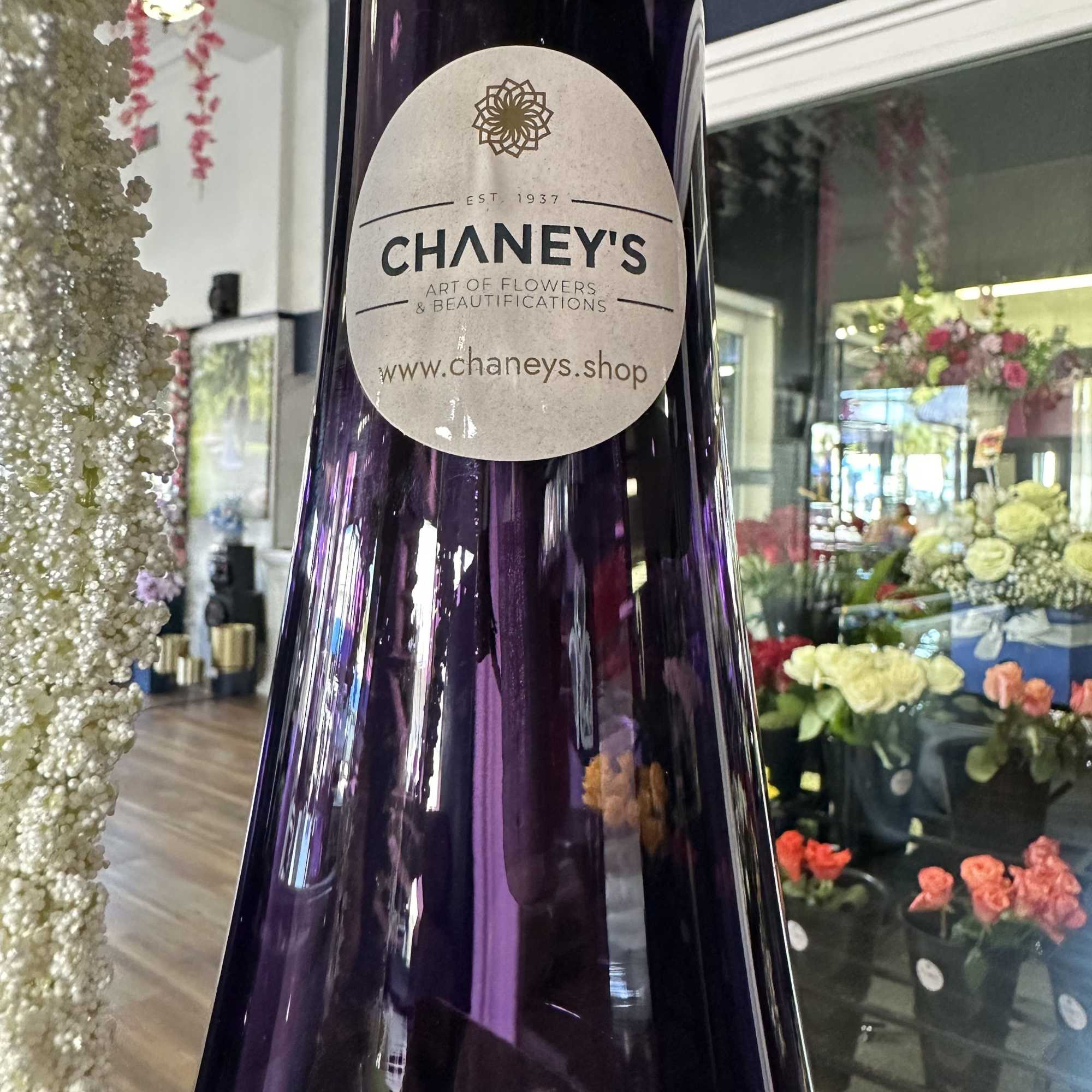 Unique piece! 31&ldquo; tall purple vase with purple and matching artificial flowers