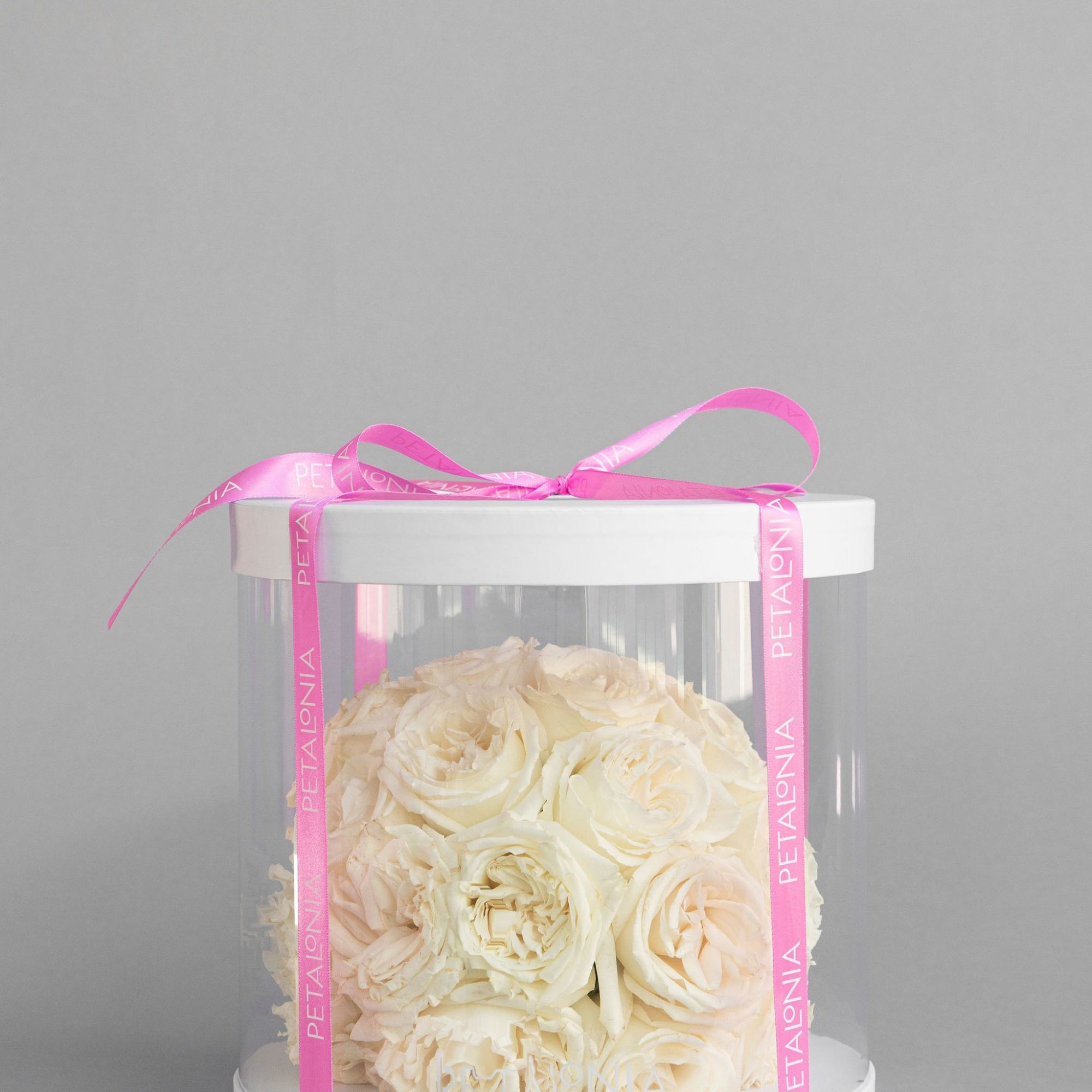 Experience timeless beauty with our preserved rose arrangement, thoughtfully presented in a
