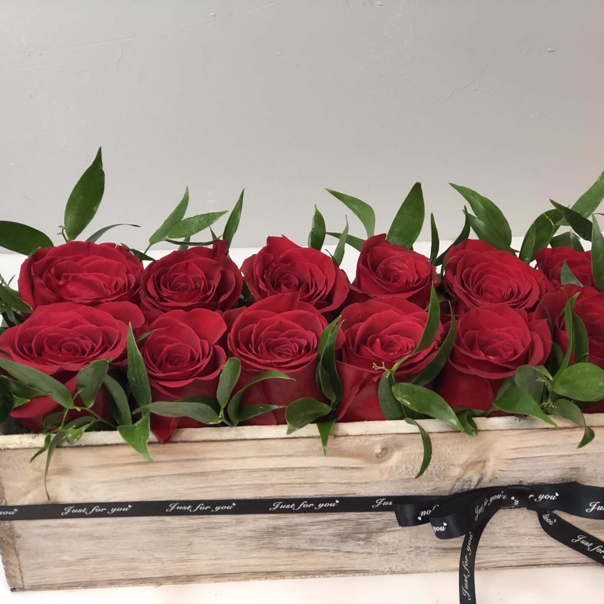 Dozen red roses in a wooden rustic box  Dozen red roses in a wooden rustic box