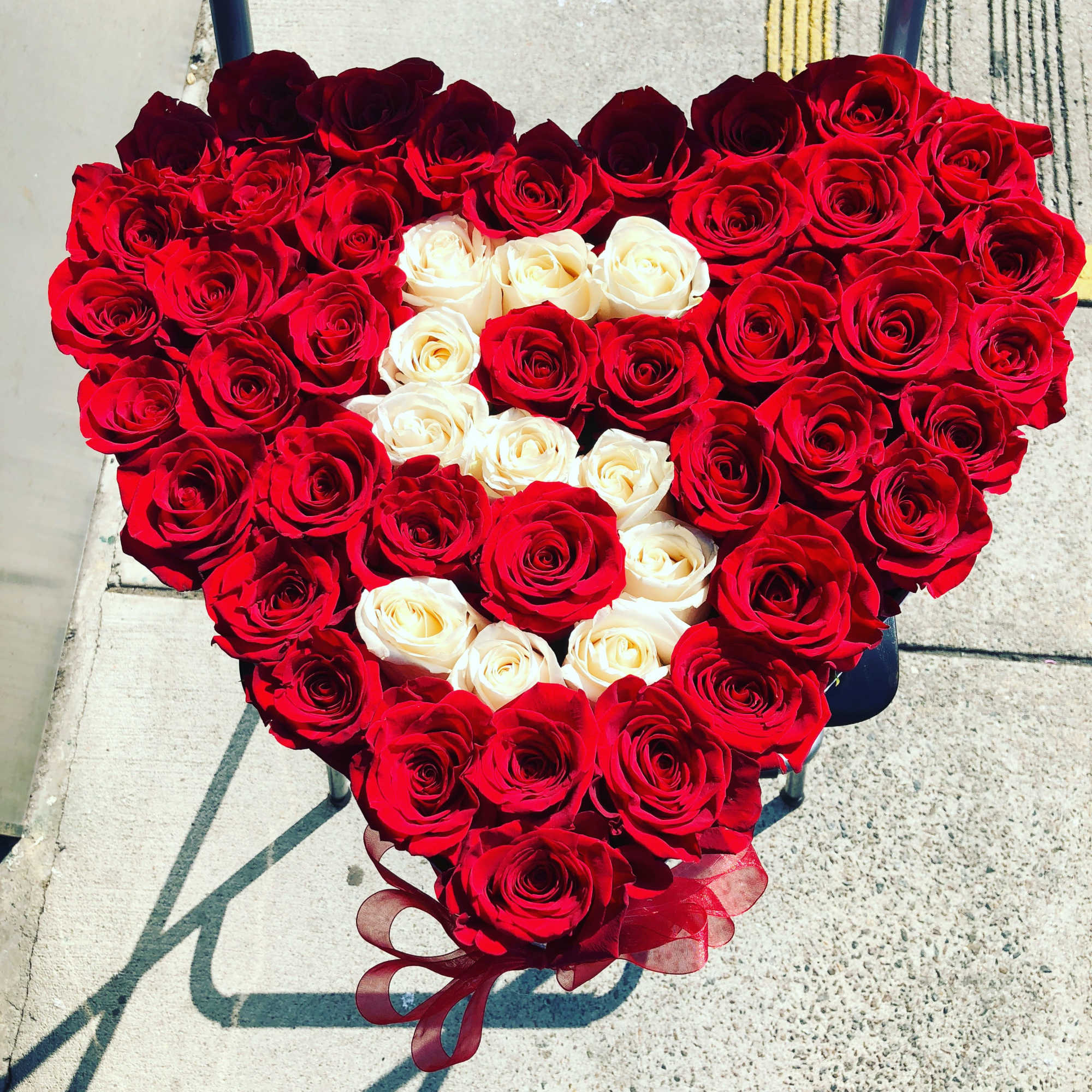 Custom designed heart shape with roses one of the most unique floral