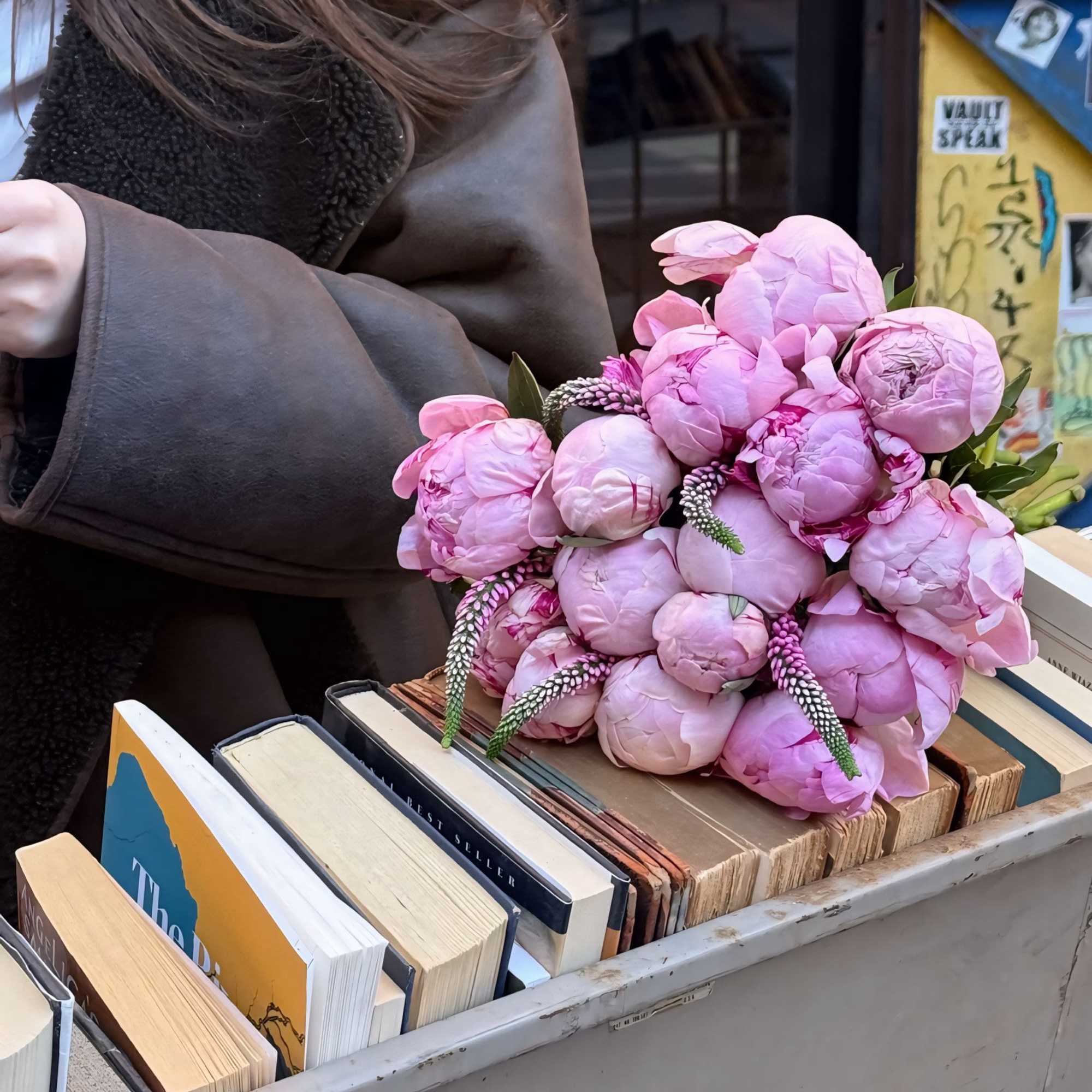 Peonies symbolize spring and sophistication; their lush blooms and delicate fragrance create
