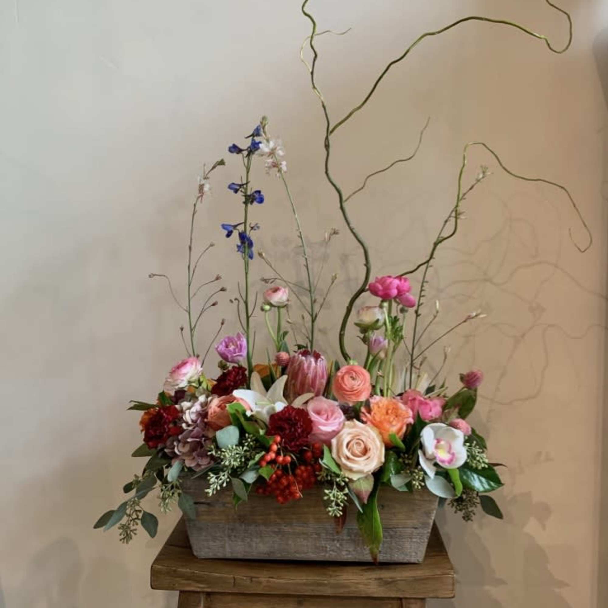 Roses, ranunculus, protea, orchid