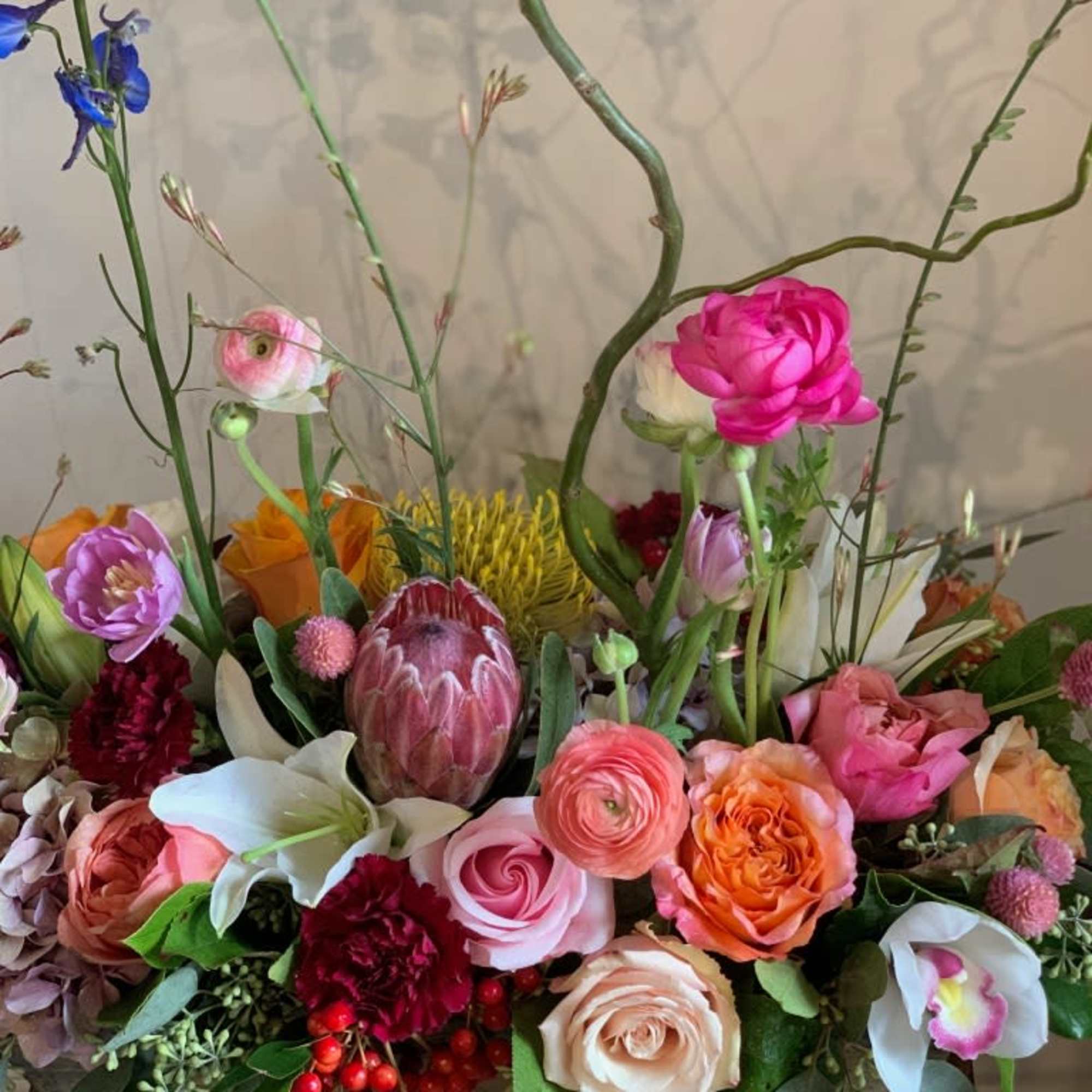 Roses, ranunculus, protea, orchid