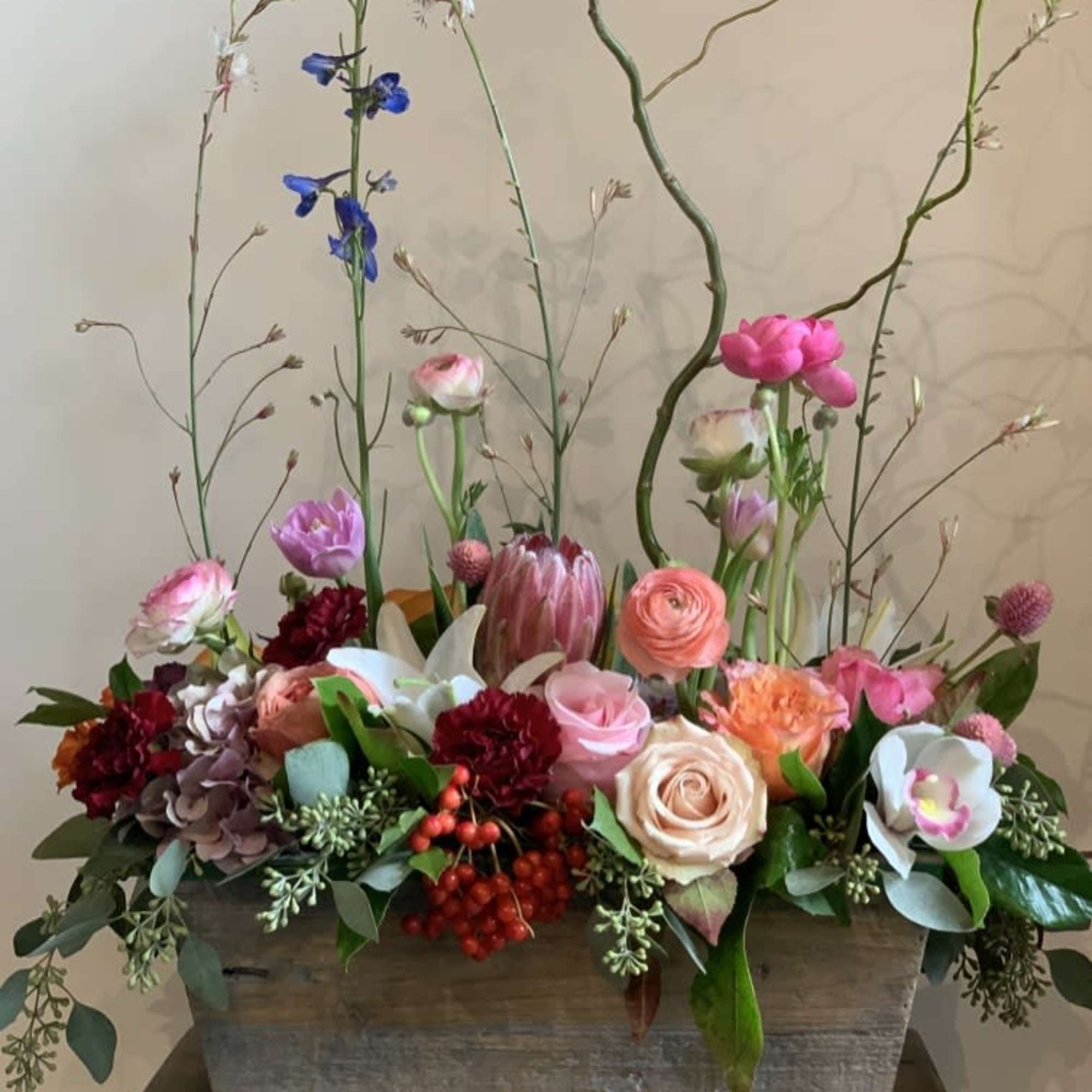 Roses, ranunculus, protea, orchid