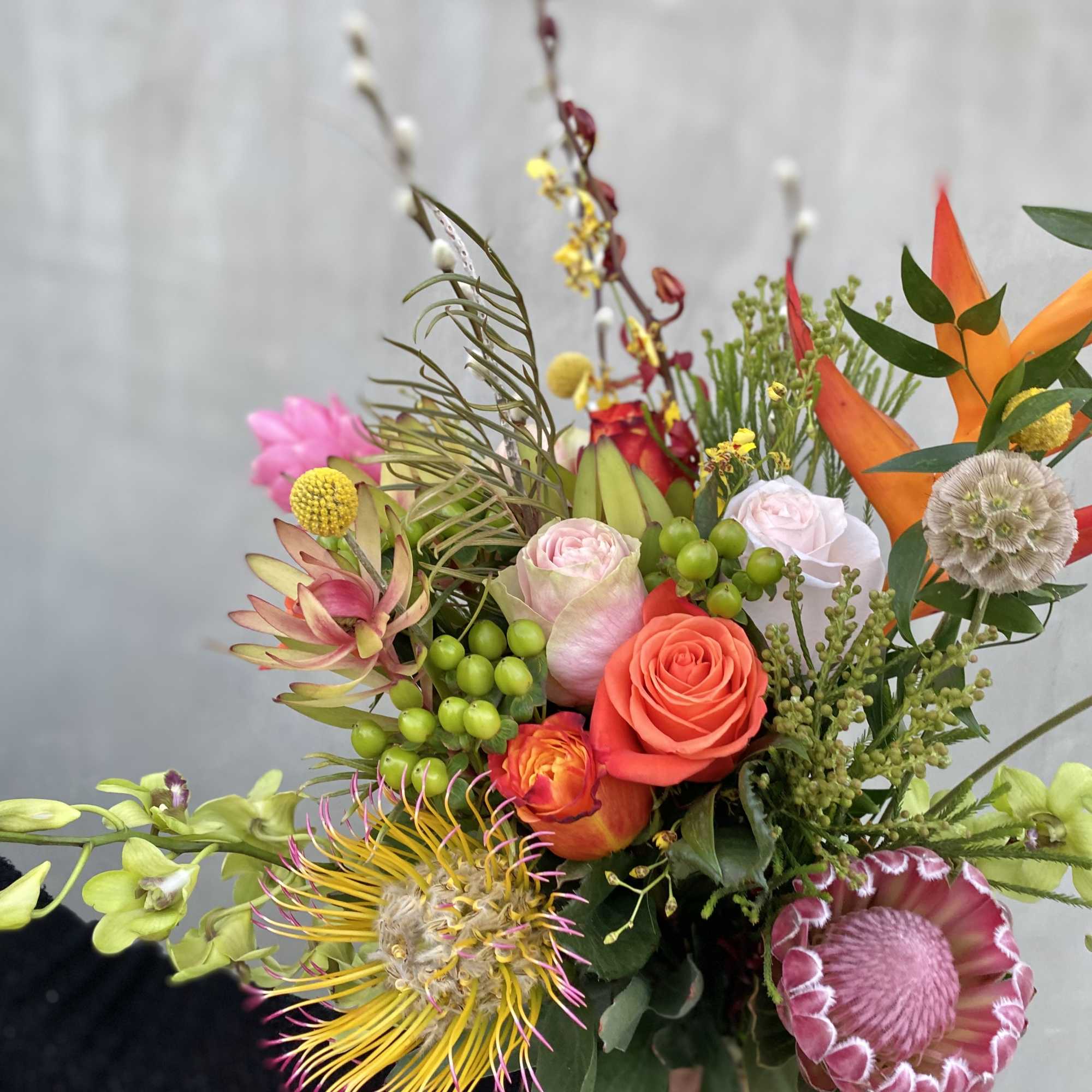  This wild bouquet includes a variety of seasonal blooms wrapped in