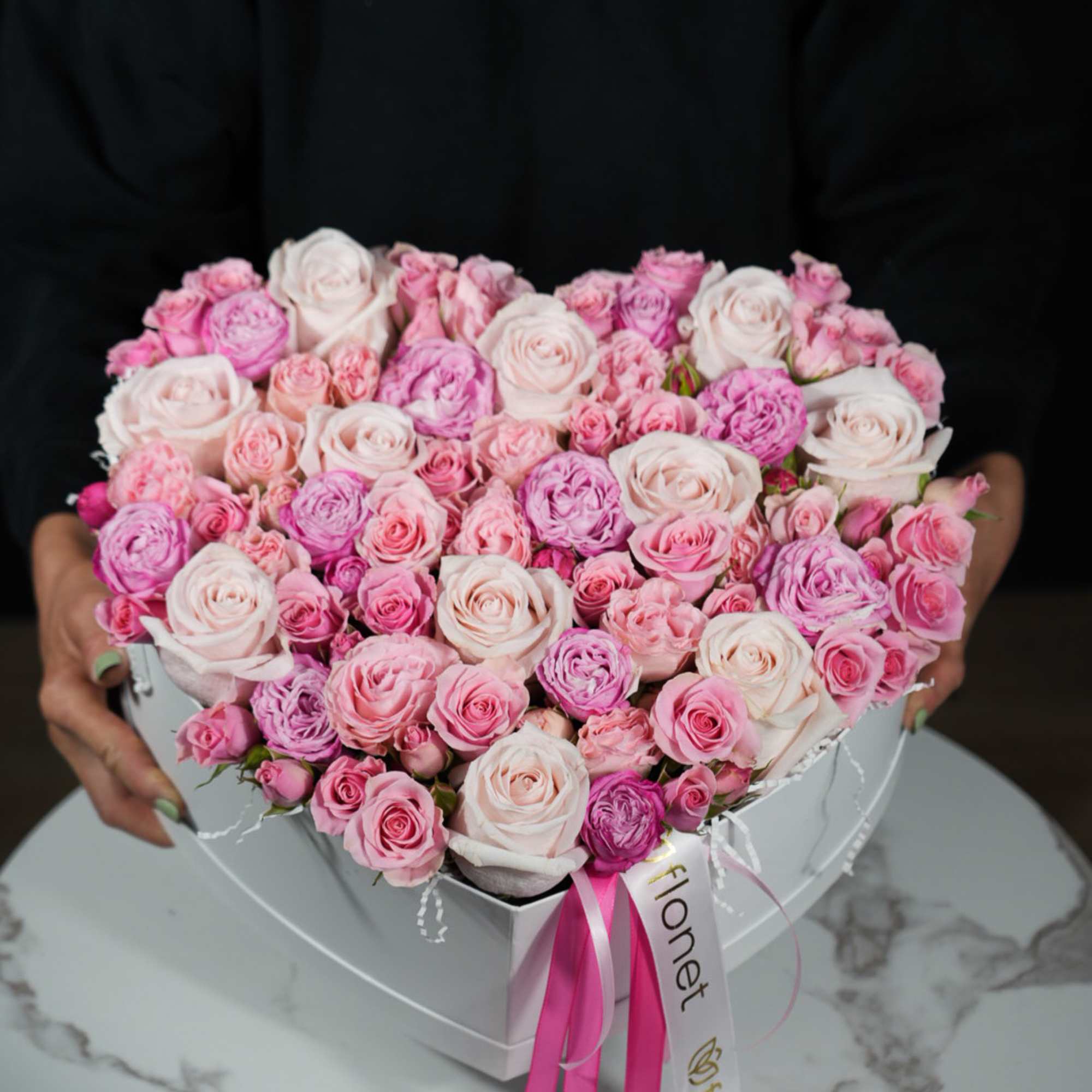 The Heartfelt Pink Roses arrangement is a stunning display of love and