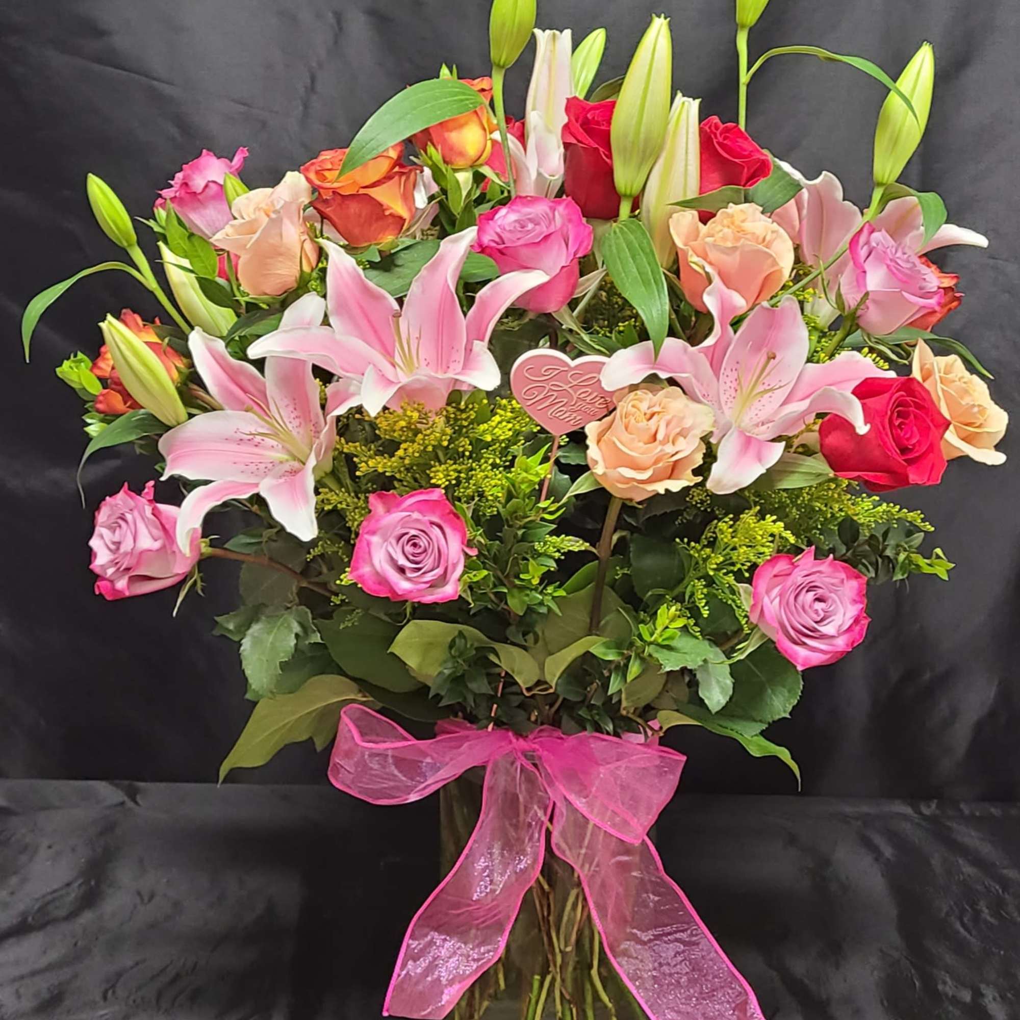 Two dozen mixed colored roses. COLORS MAY VARY. Upgrade come with Lillies. Two dozen mixed colored roses. COLORS MAY VARY. Upgrade come with Lillies.