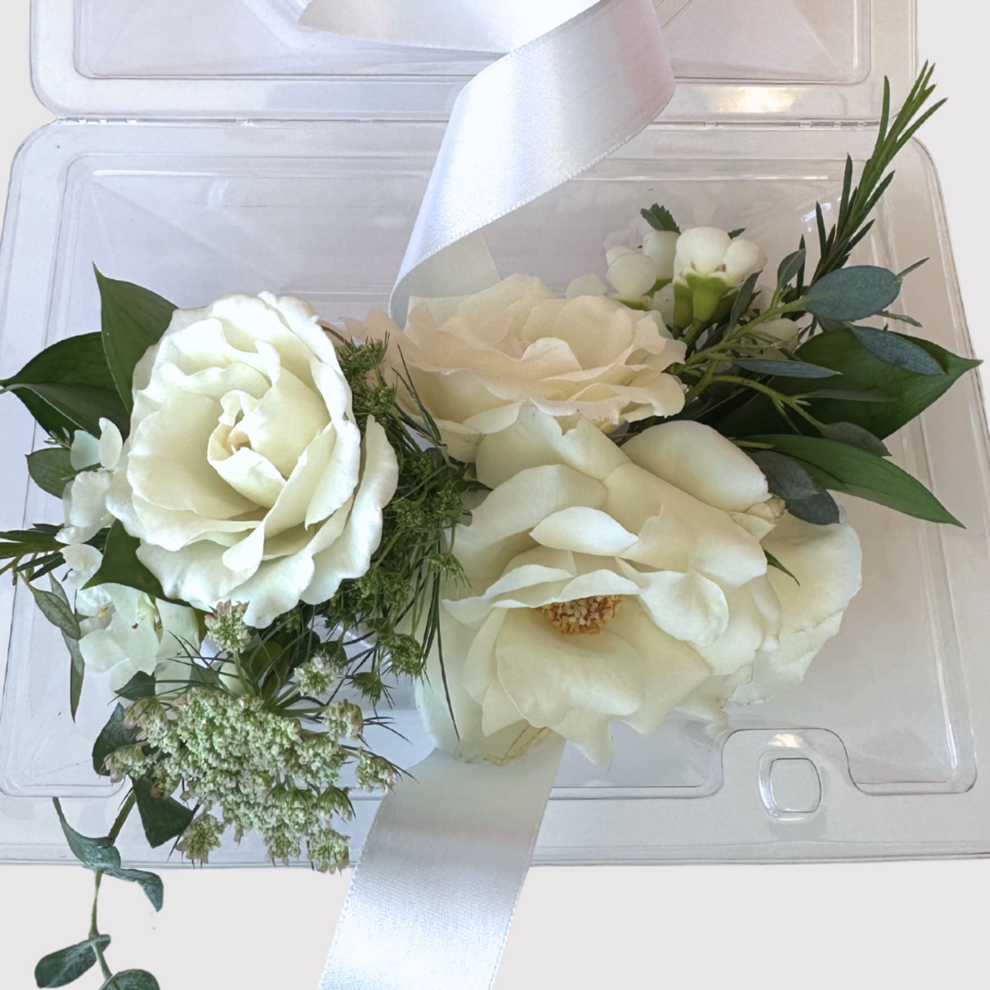 Signature corsage in client&#039;s preferred color palette. Finished with romantic chiffon ribbon
