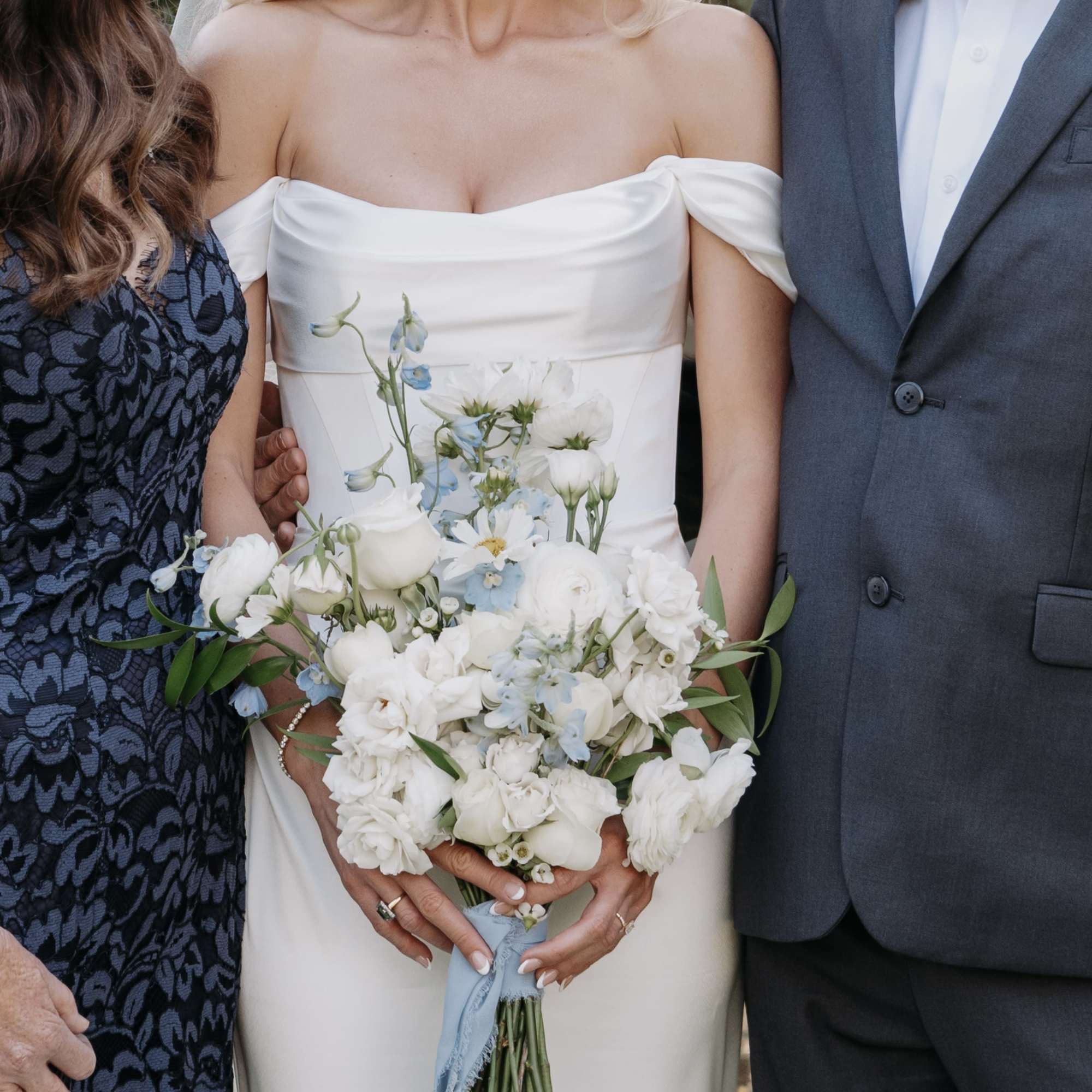Signature Bridal bouquet bursting with beautiful blooms. Hand-tied and finished with romantic