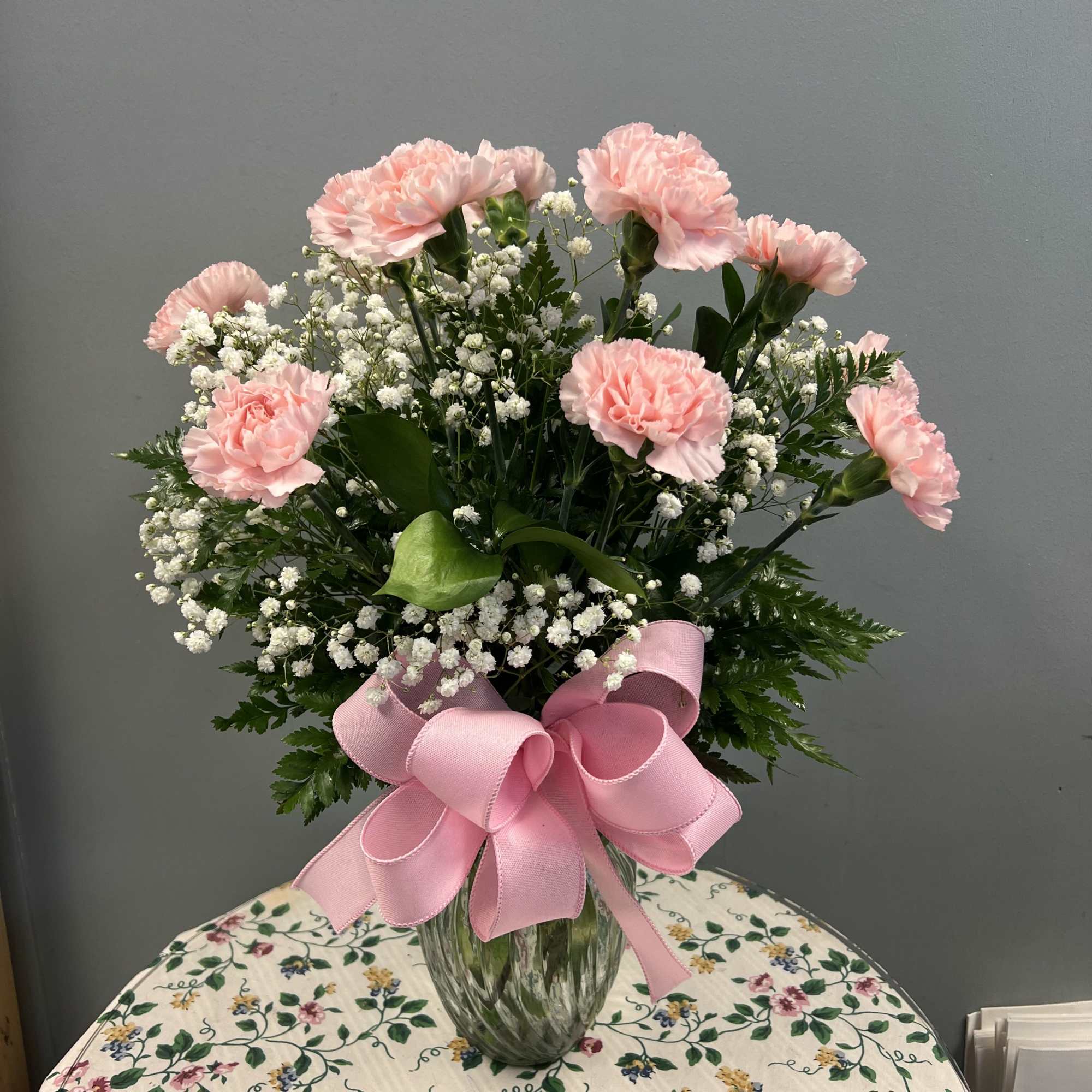 Carnations, premium greenery and filler. **Actual color of carnations may vary due