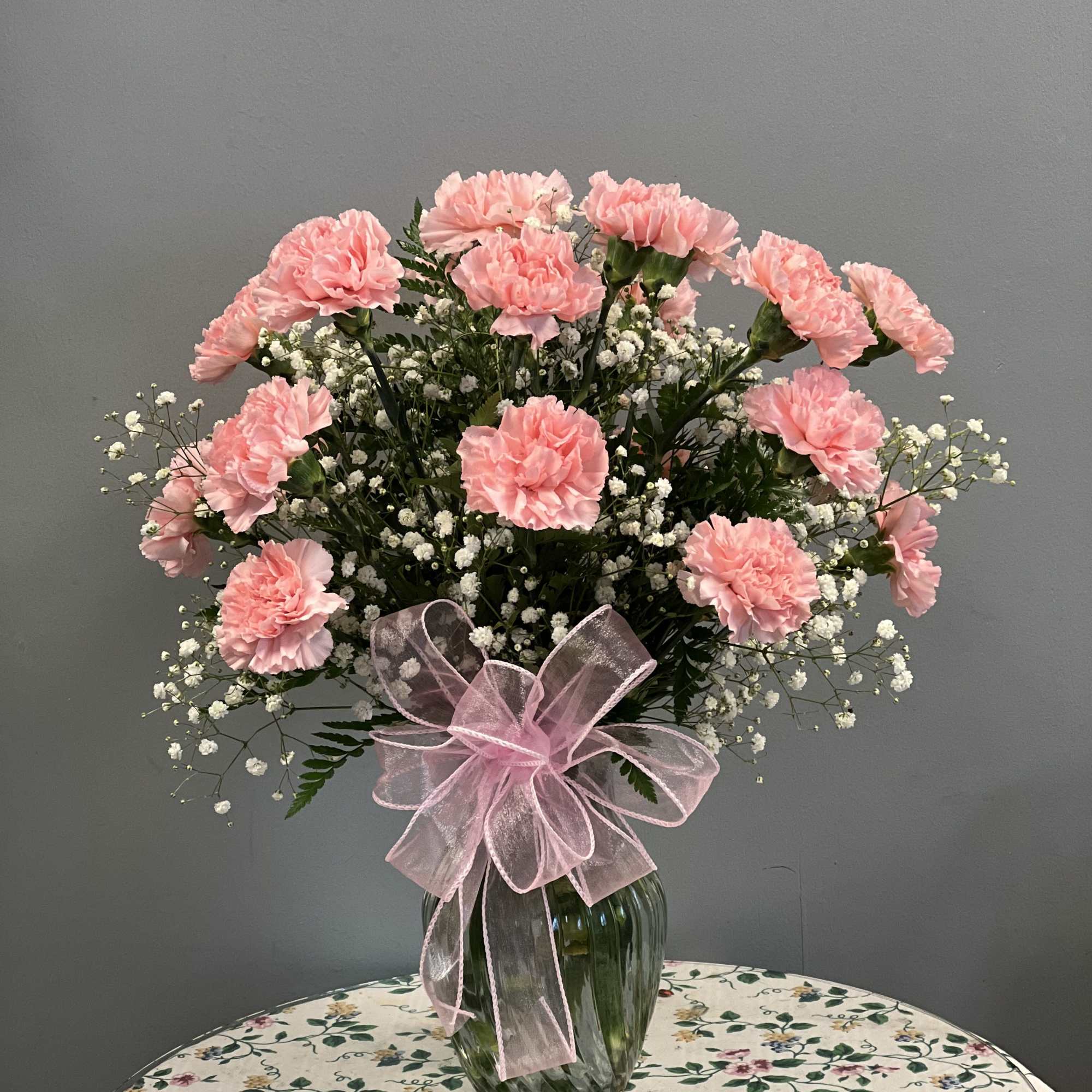 Carnations, premium greenery and filler. **Actual color of carnations may vary due