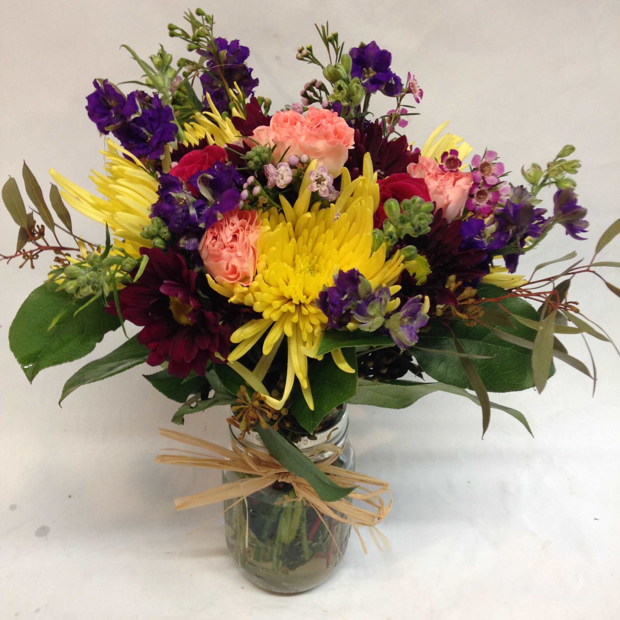 This arrangement is a colorful mixture of all things wild.  All