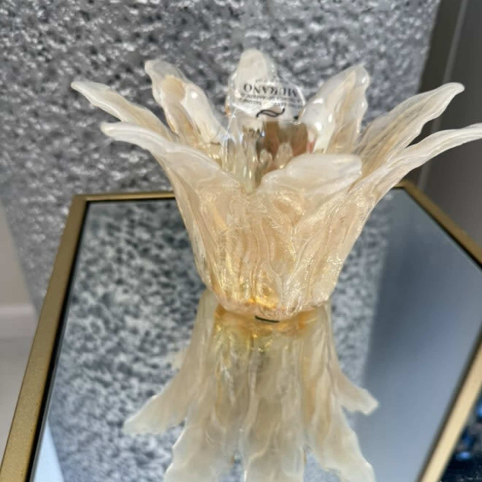  A radiant centerpiece shaped like an open blossom, featuring warm yellow