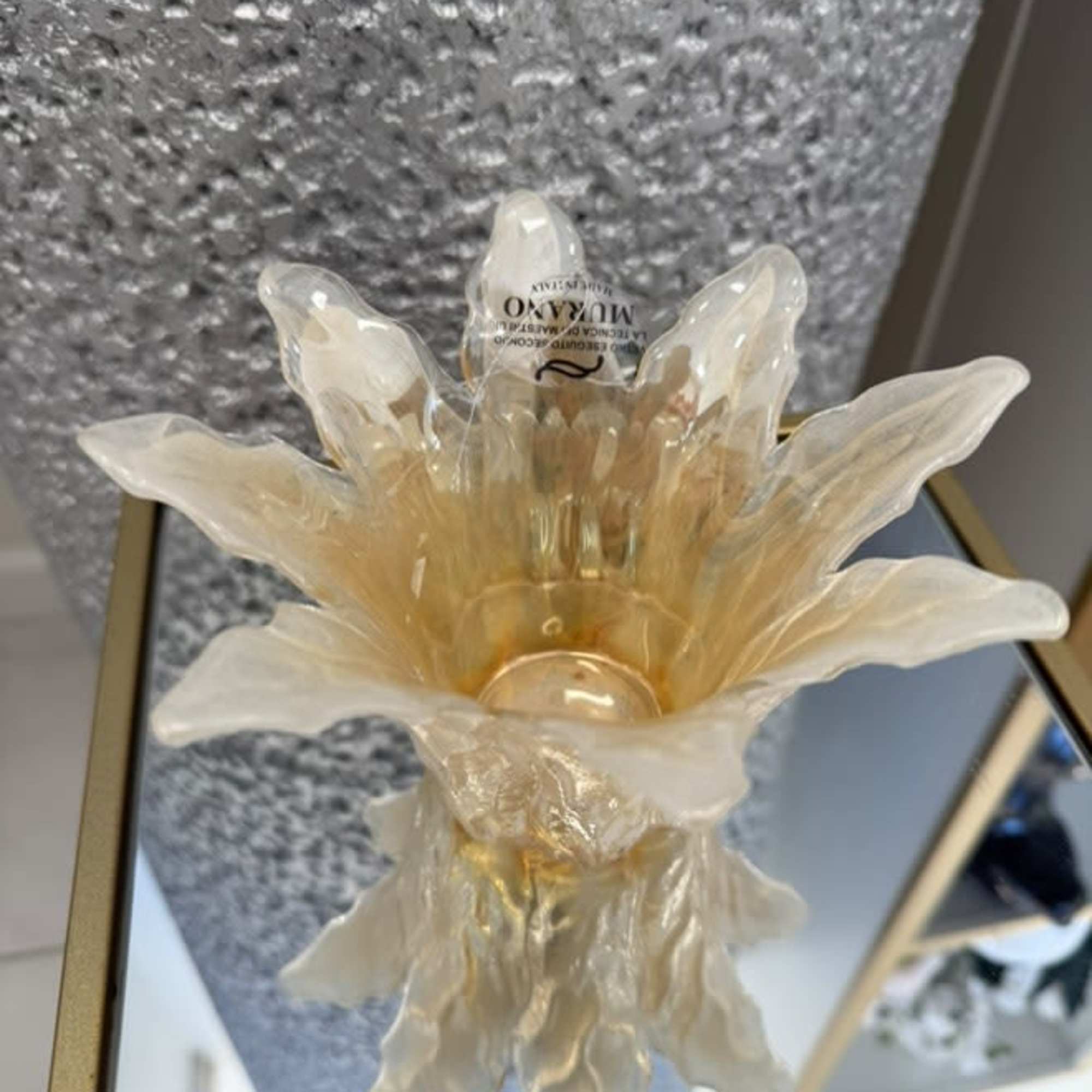  A radiant centerpiece shaped like an open blossom, featuring warm yellow