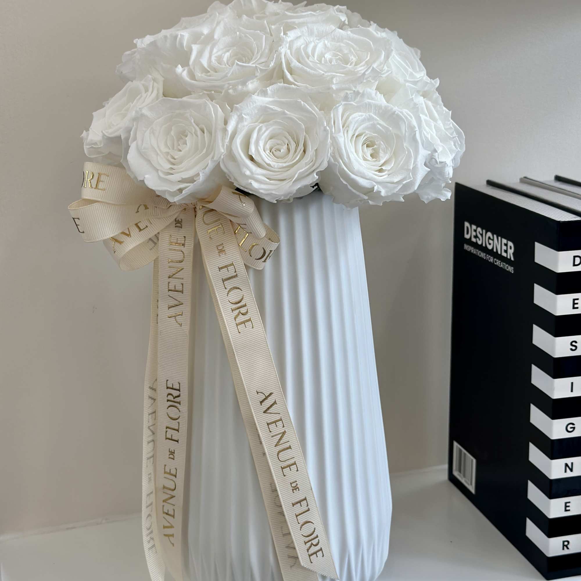 Elevate your space with this stunning arrangement, elegantly presented in a chic