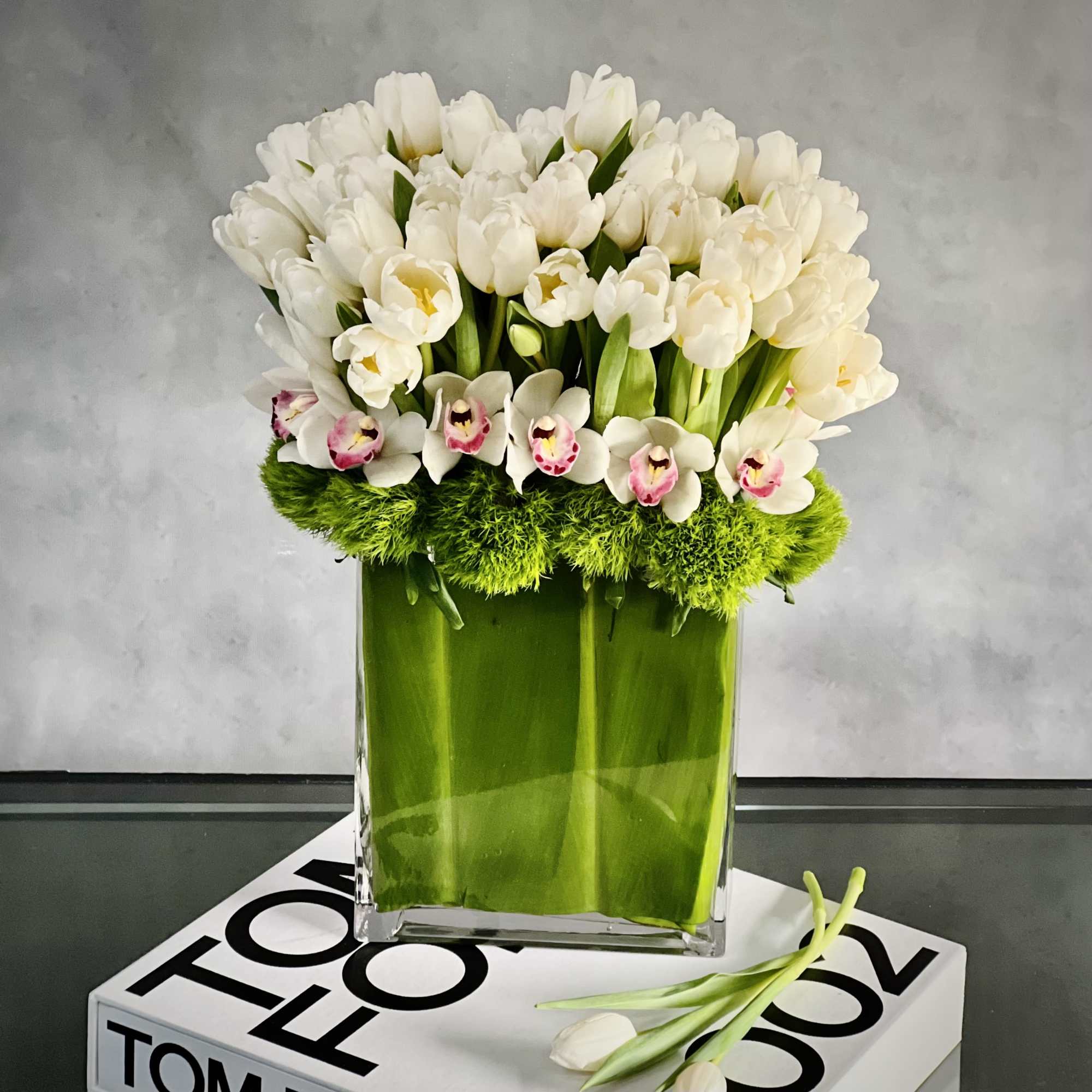 Amaze someone with this striking bouquet of tall Dutch Tulips and Orchids