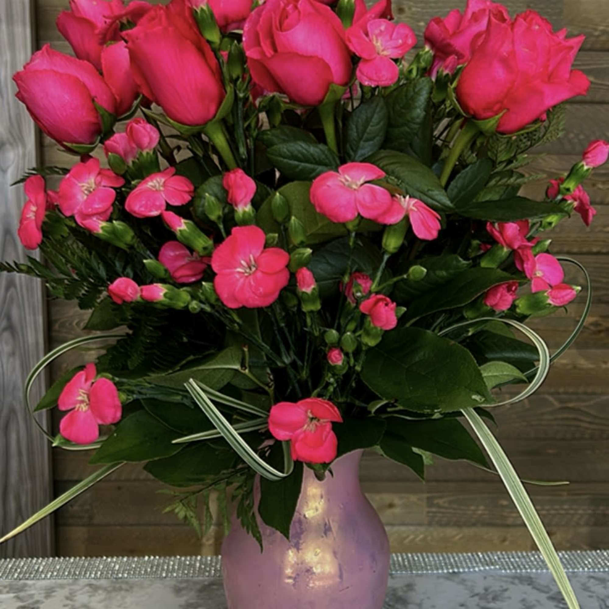 Stunning floral arrangementfeaturing a delicate blend of pink hues. perfect for expressing