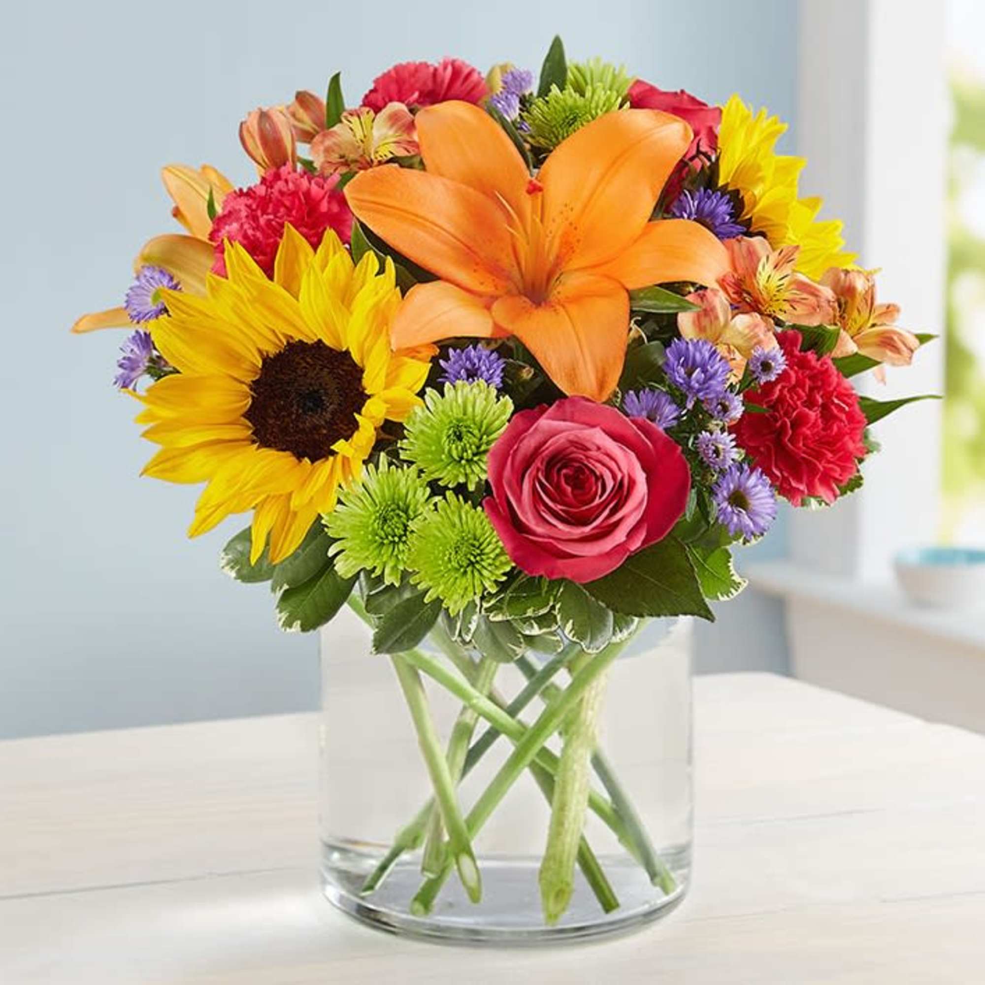 Like a warm embrace, our vibrant bouquet delivers your sentiments to someone