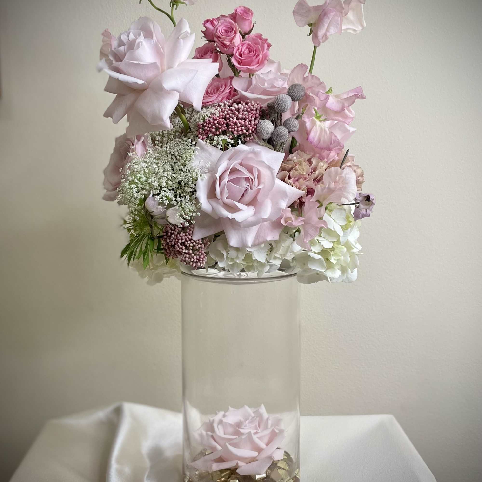 Taking our floating centerpiece to new heights, this arrangement will be the