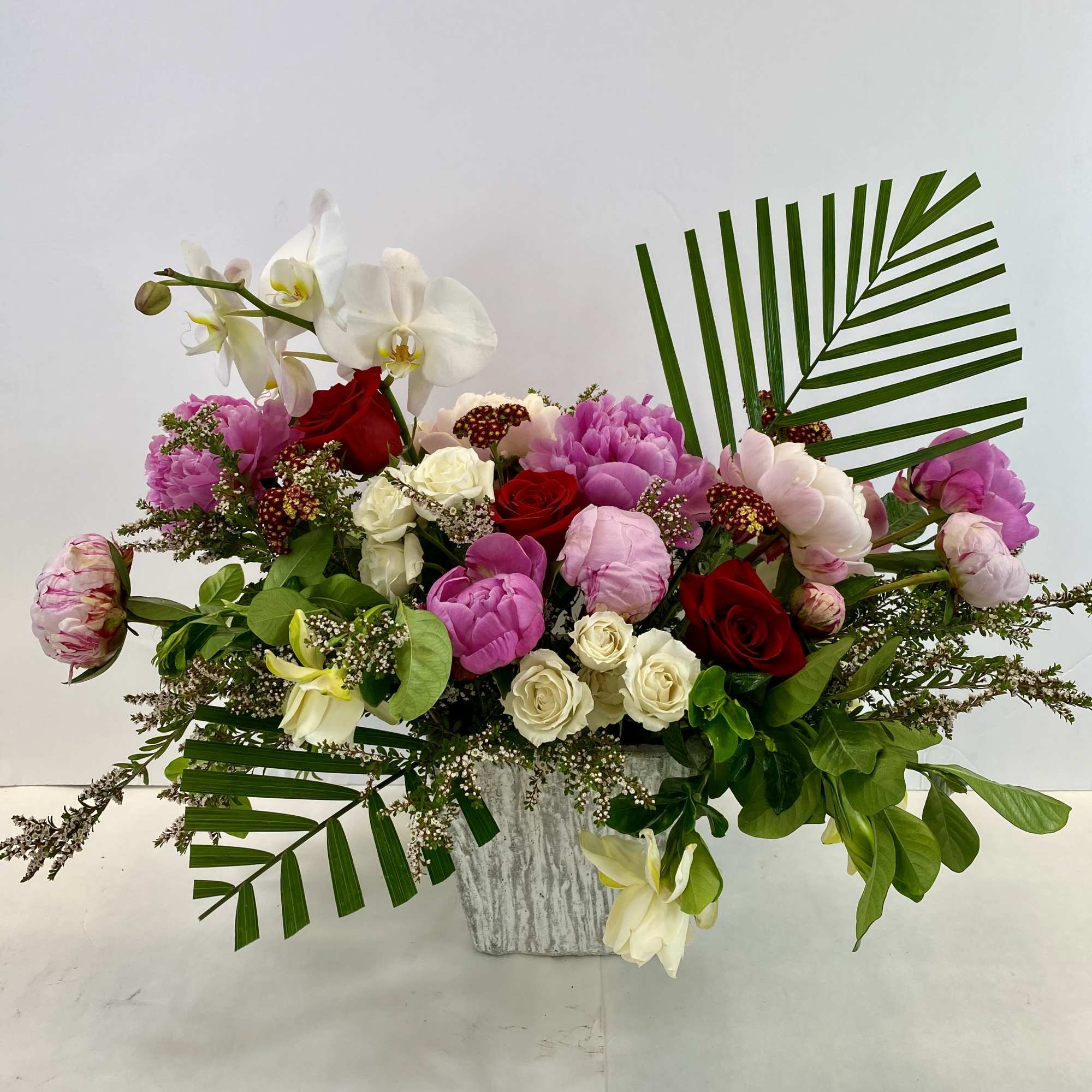 Spectacular modern flower arrangement to impress. Peonies or garden roses, roses, elegant