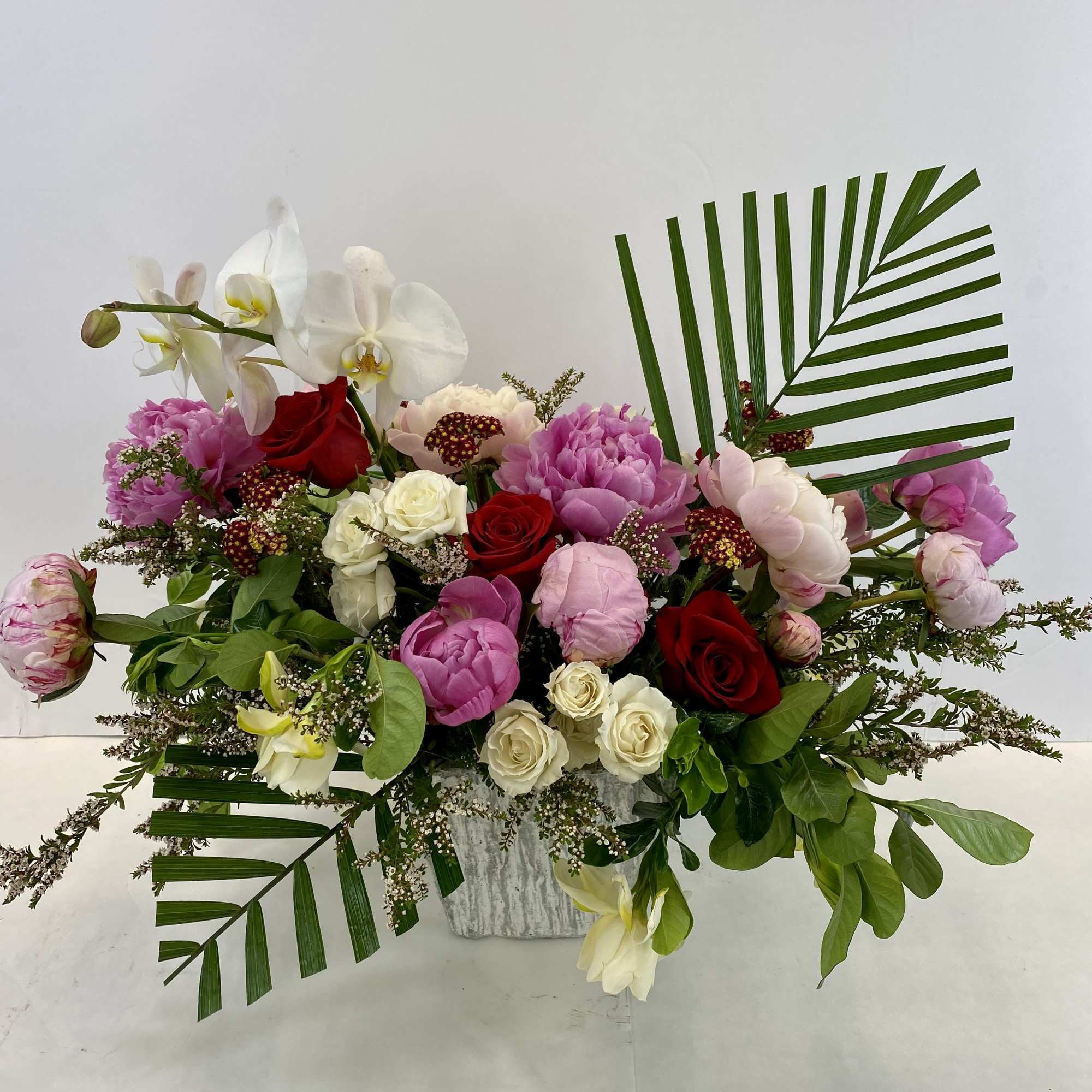 Spectacular modern flower arrangement to impress. Peonies or garden roses, roses, elegant