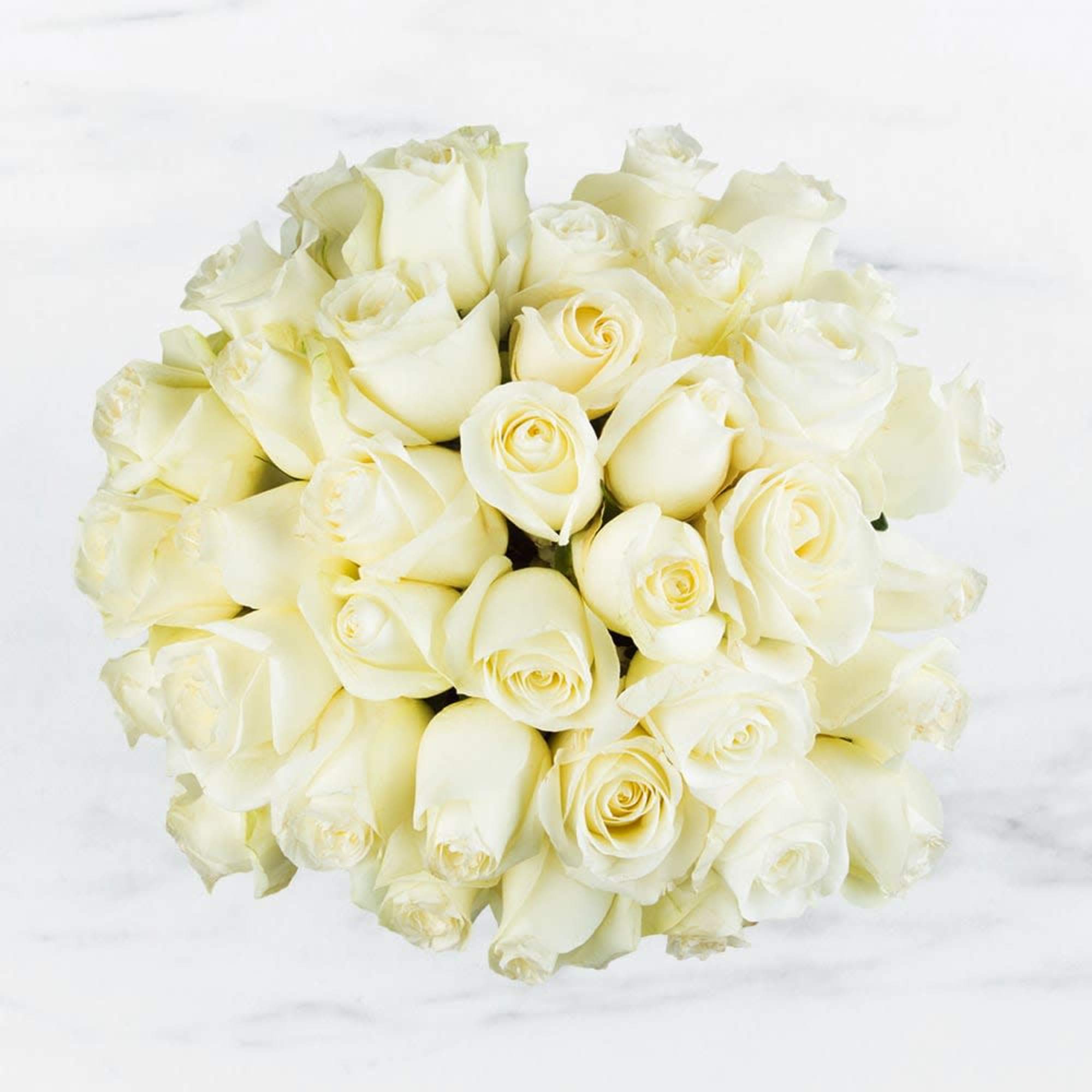 Make a bold statement with this elegantly simple design. White roses symbolize Make a bold statement with this elegantly simple design. White roses symbolize