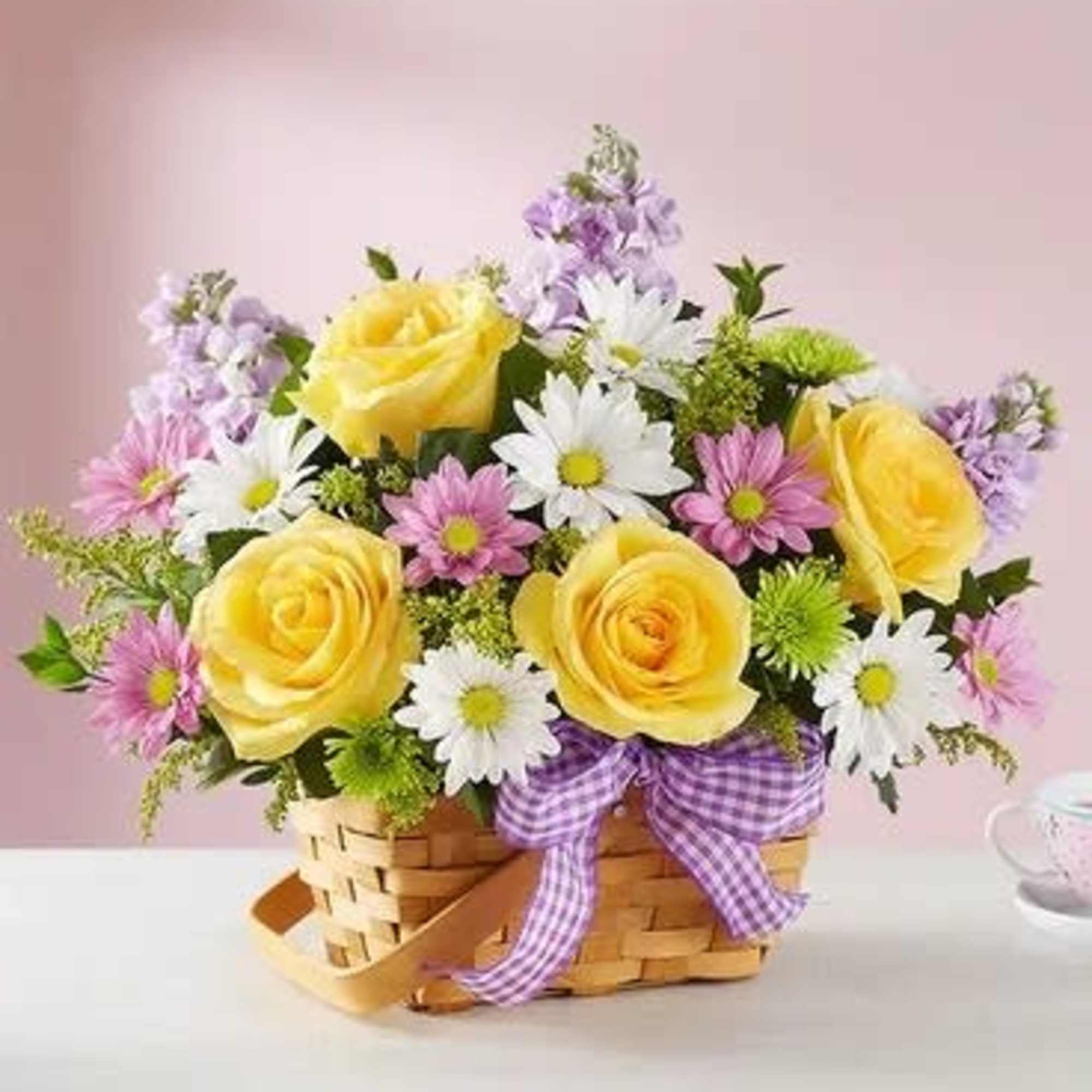 Bright, sunny springtime wishes are best sent with our charming basket arrangement. Bright, sunny springtime wishes are best sent with our charming basket arrangement.