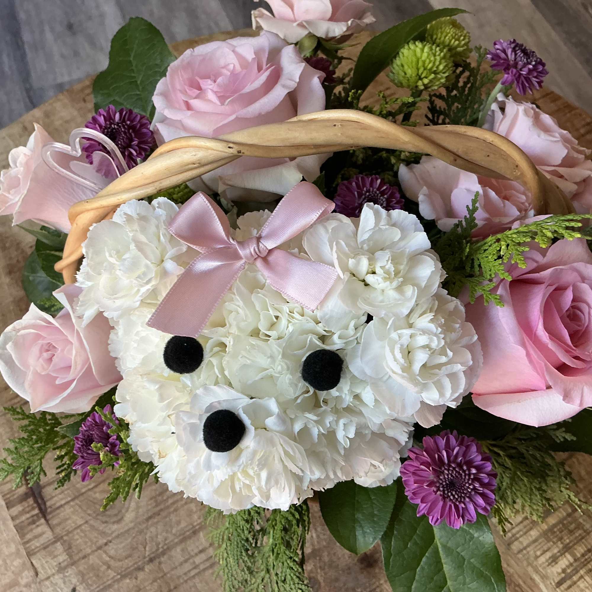 Fine and cute arrangement, on a Basket, forming a cute little puppy