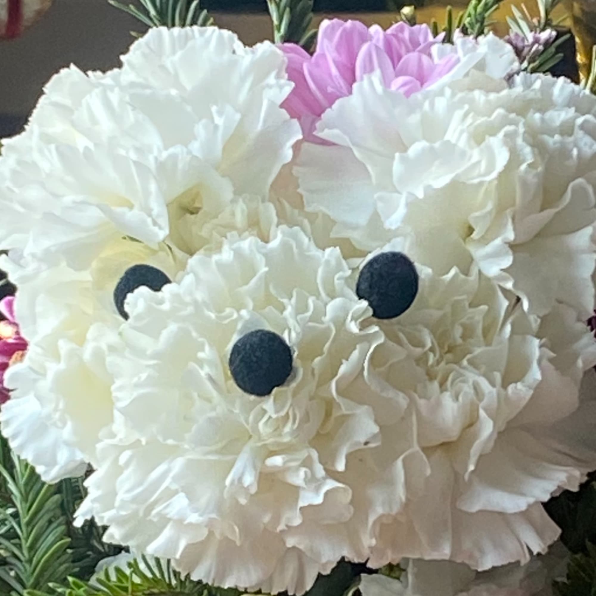 Fine and cute arrangement, on a Basket, forming a cute little puppy