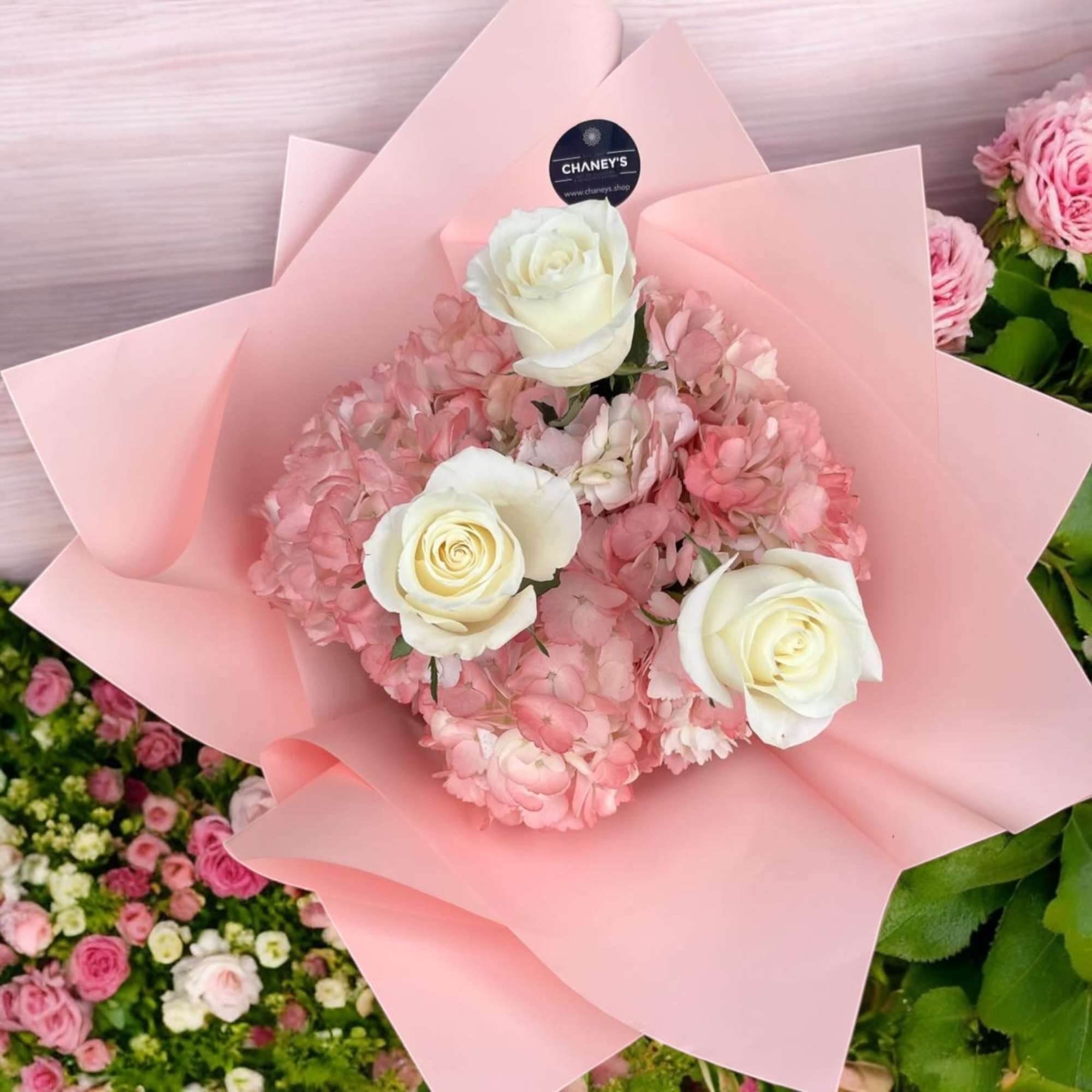 Pretty light pink wrap arranged with roses and hydrangeas. A perfect gift Pretty light pink wrap arranged with roses and hydrangeas. A perfect gift