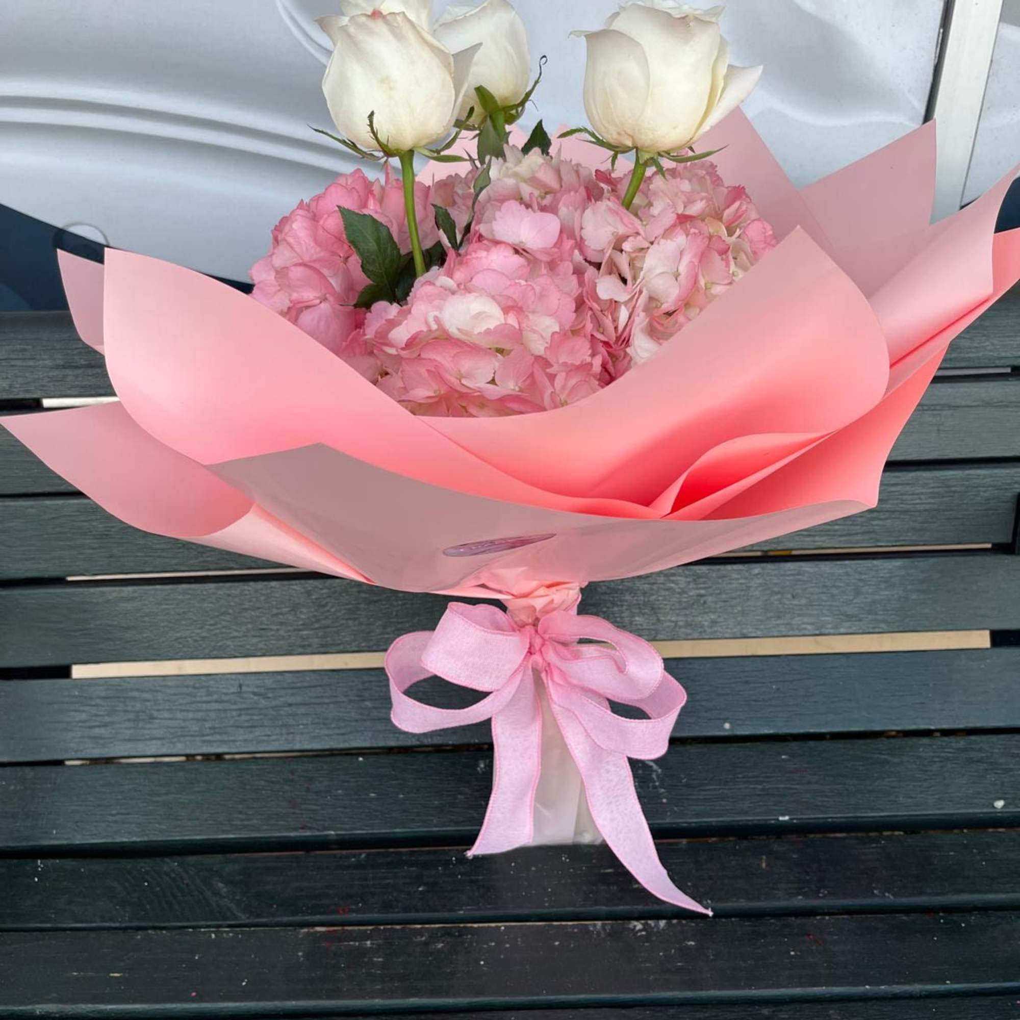 Pretty light pink wrap arranged with roses and hydrangeas. A perfect gift Pretty light pink wrap arranged with roses and hydrangeas. A perfect gift