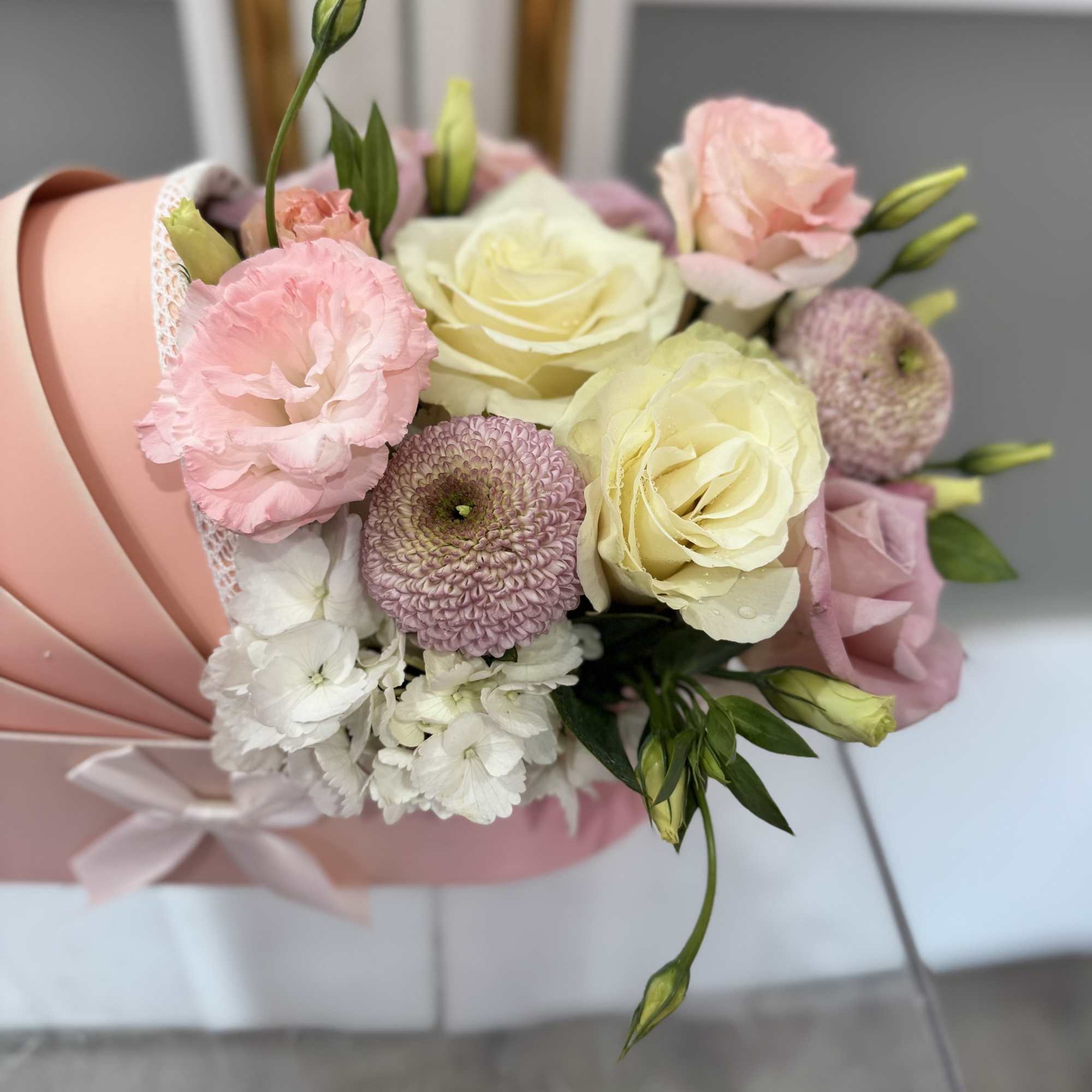 Premium floral designed in our signature carriage box with a personalized balloon