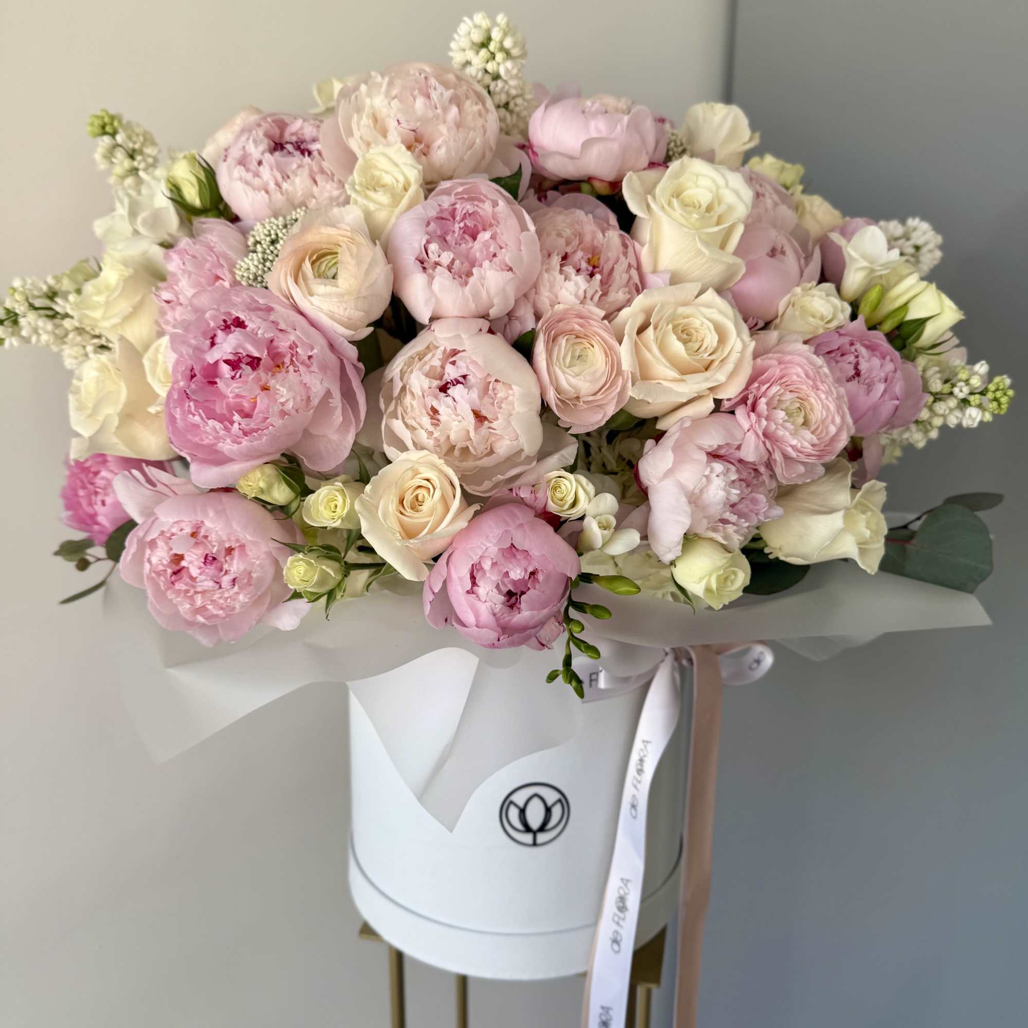 A breathtakingly romantic arrangement of delicate pink peonies, creamy white roses, and A breathtakingly romantic arrangement of delicate pink peonies, creamy white roses, and