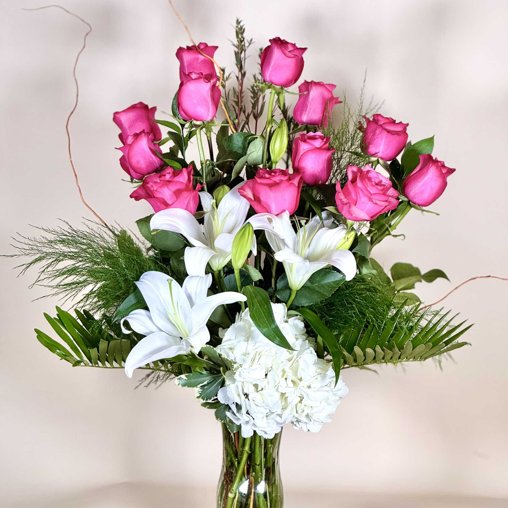 Bold, elegant, and full of grace, this stunning arrangement combines the timeless