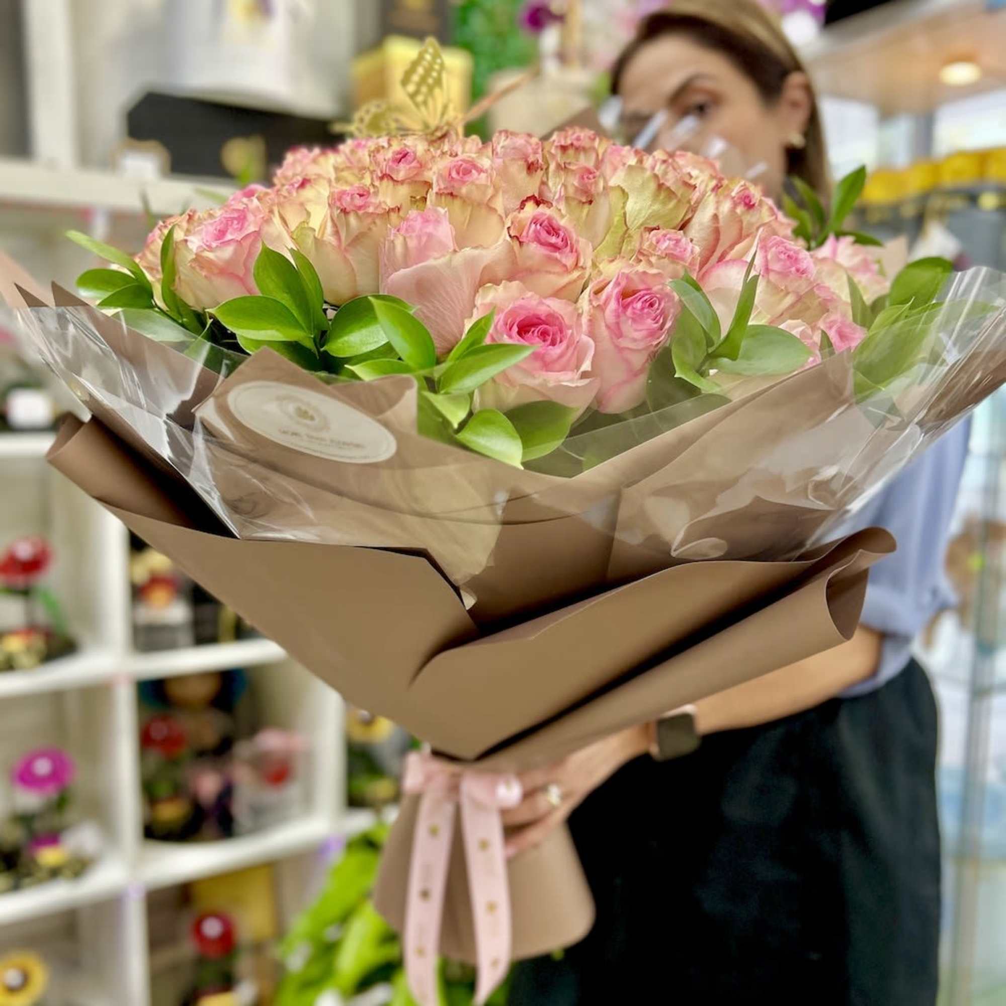 Artistically wrapped in our special Euro Floral paper accented with a decorated