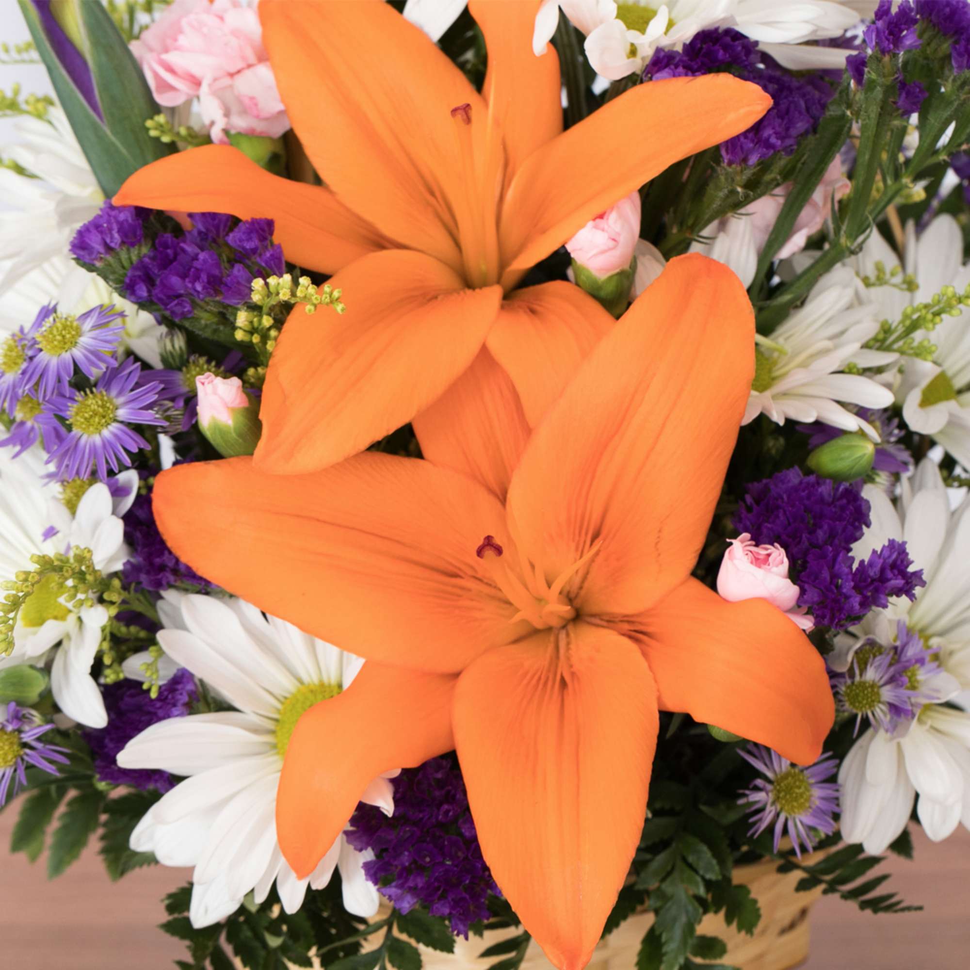 Overflowing with vibrance and energy, this mixed floral basket is a delightful