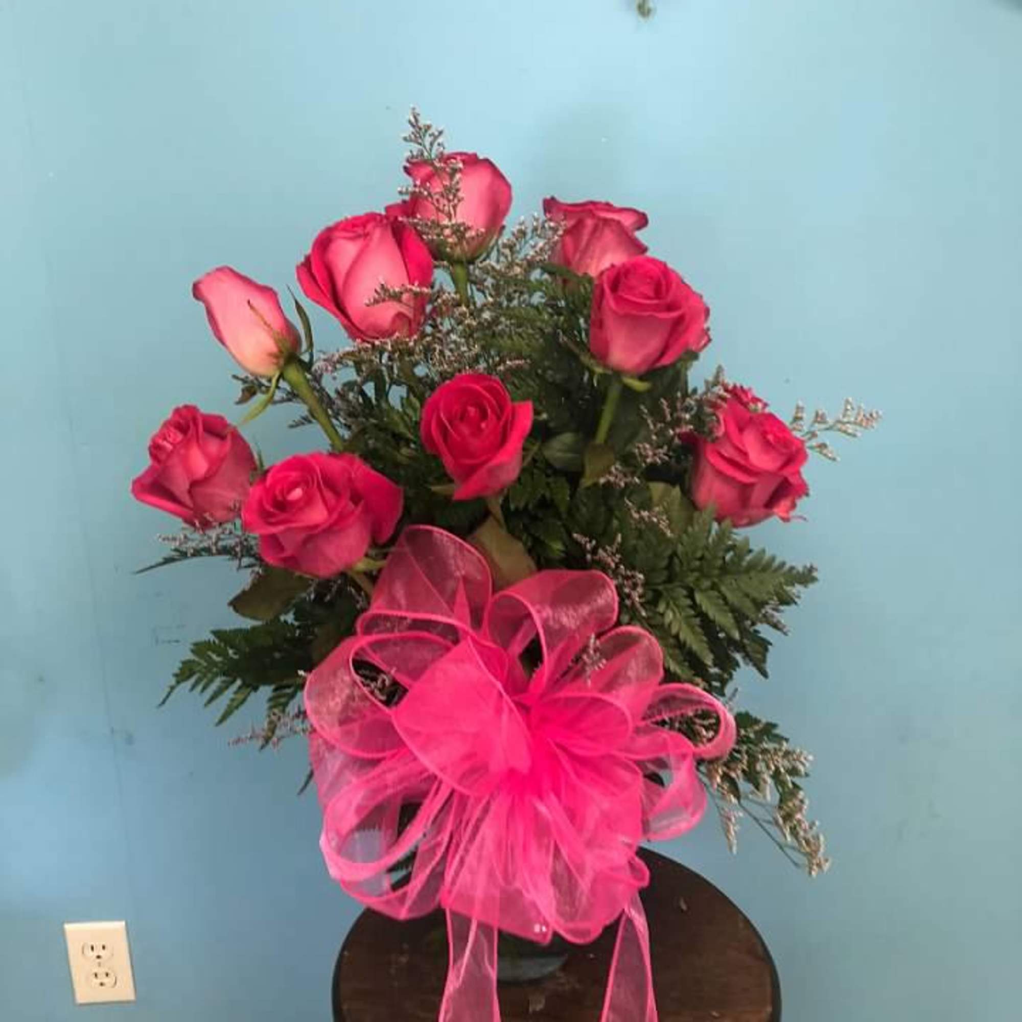 These pink roses are cheerful and fun! Dozen Long Stemmed Pink Roses.