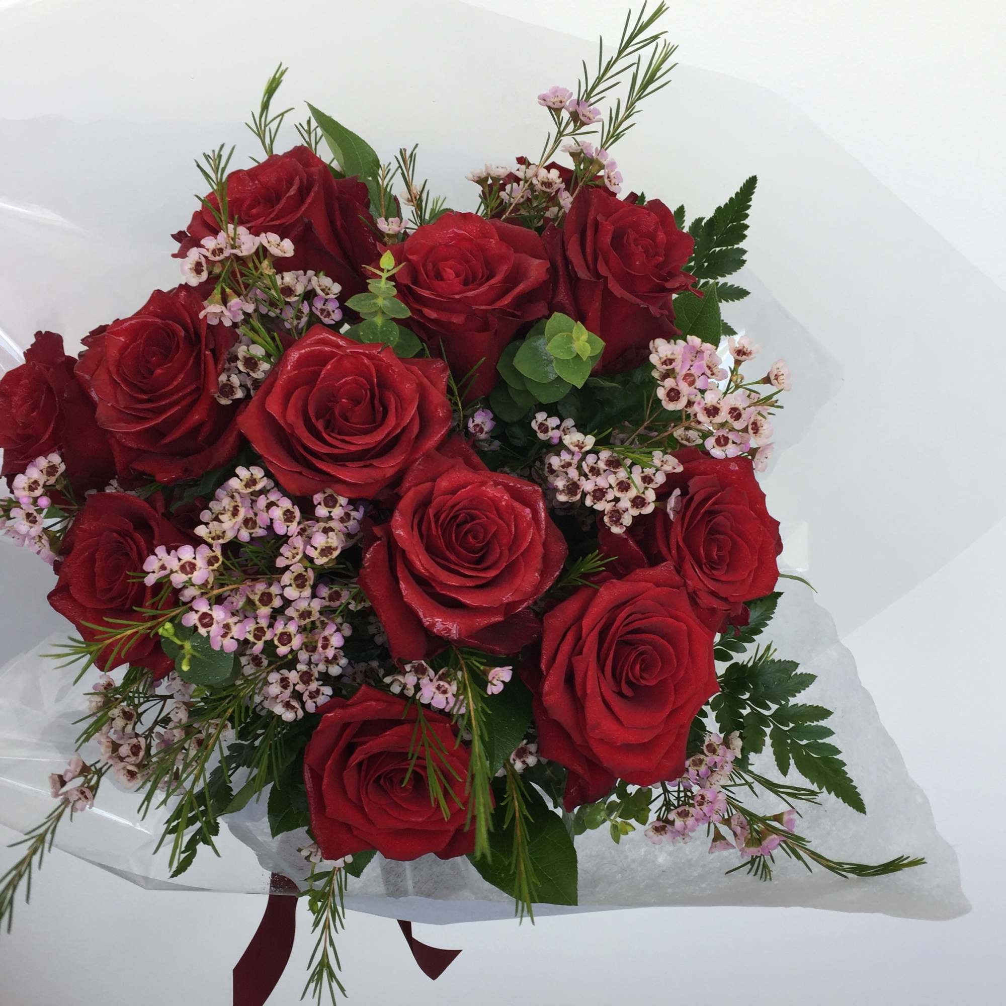 Twelve long stemmed roses in your choice of color with the works.
Please