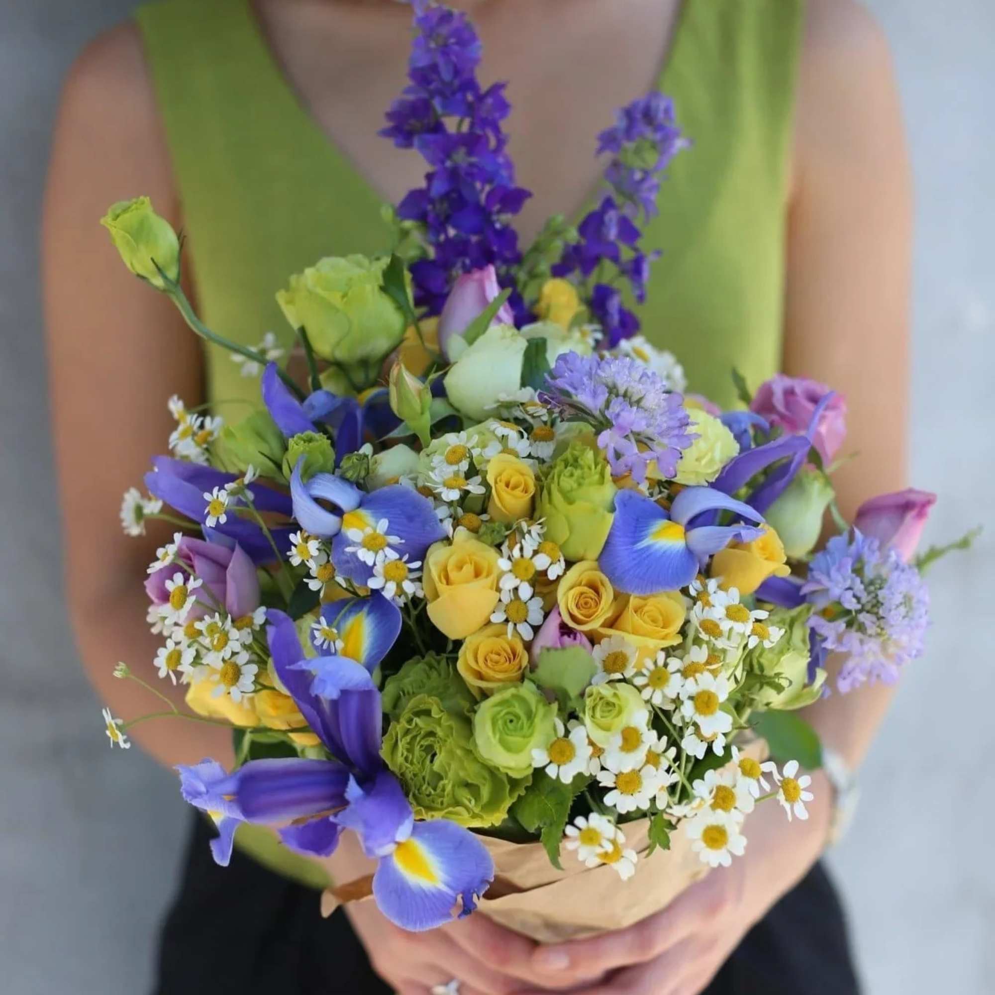 Elsie is a stunning composition with daisies and roses, irises, solidago, delphinium