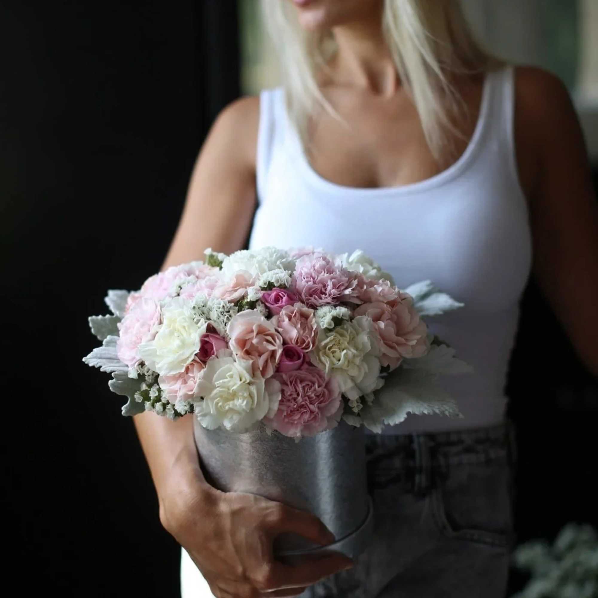 Stunning Marie arrangement consists of pink, white and peach roses and carnations