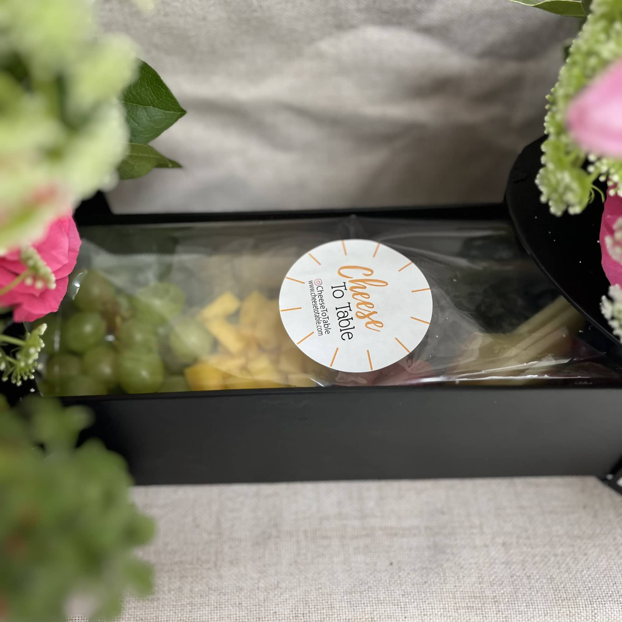 Blooms and charcuterie combination in collaboration with Cheese To Table! 
Presents as