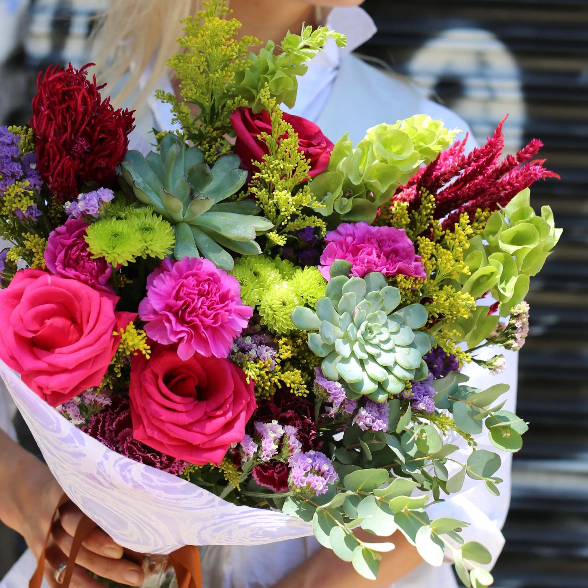 Laura is a beautiful bouquet with roses and succulents. This bright bouquet