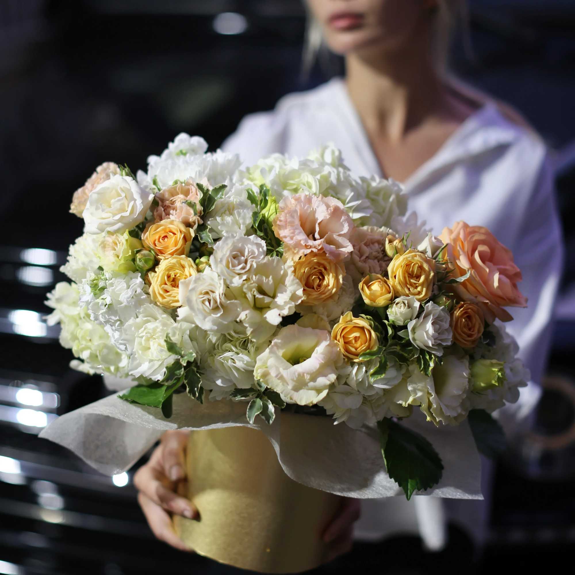 Arya is a beautiful flower arrangement of white and yellow roses, hydrangeas