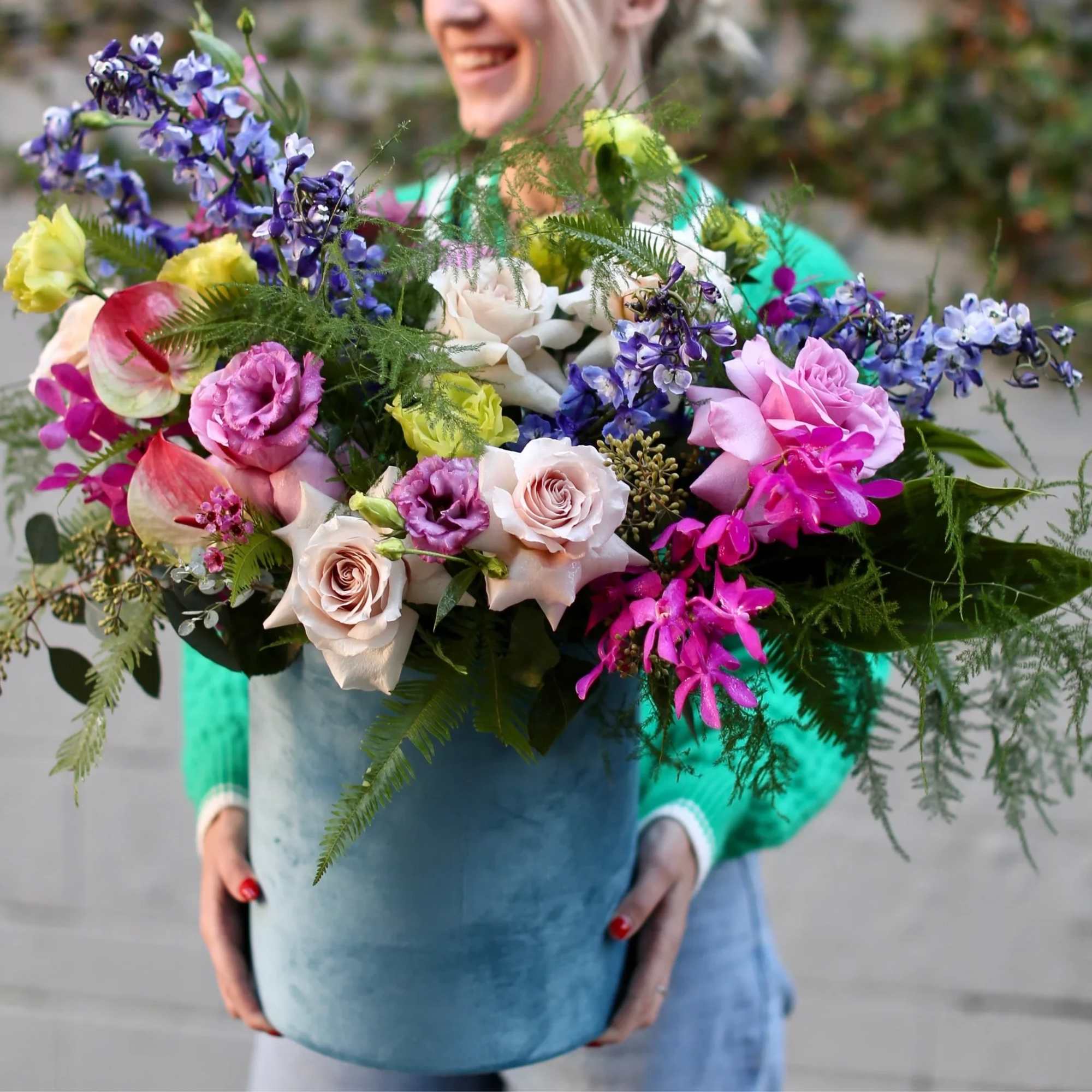 Beautiful large composition with delphinium, anthurium, greenery,  and other gorgeous flowers.
