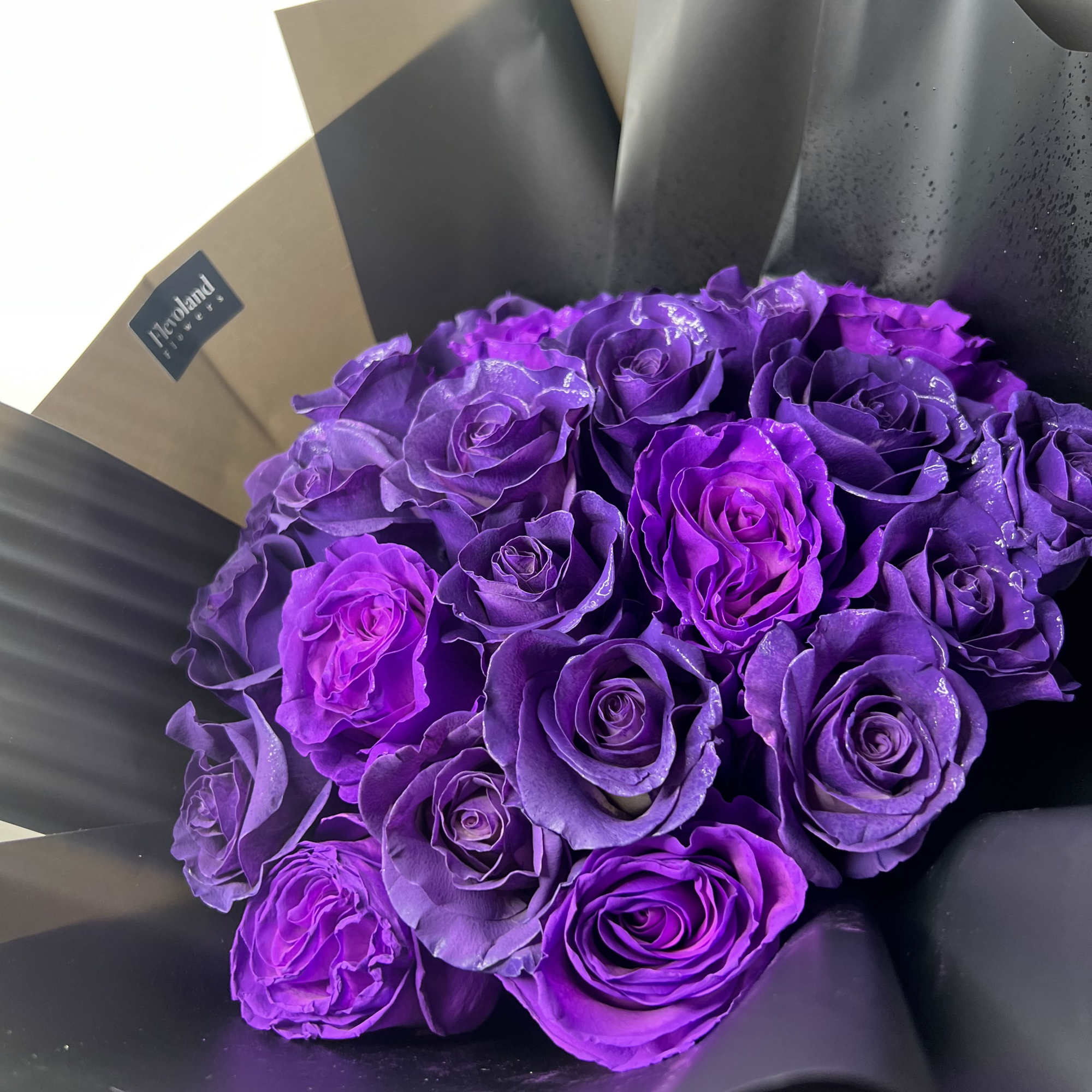 A bouquet of deep purple roses that exudes sophistication and charm. Each
