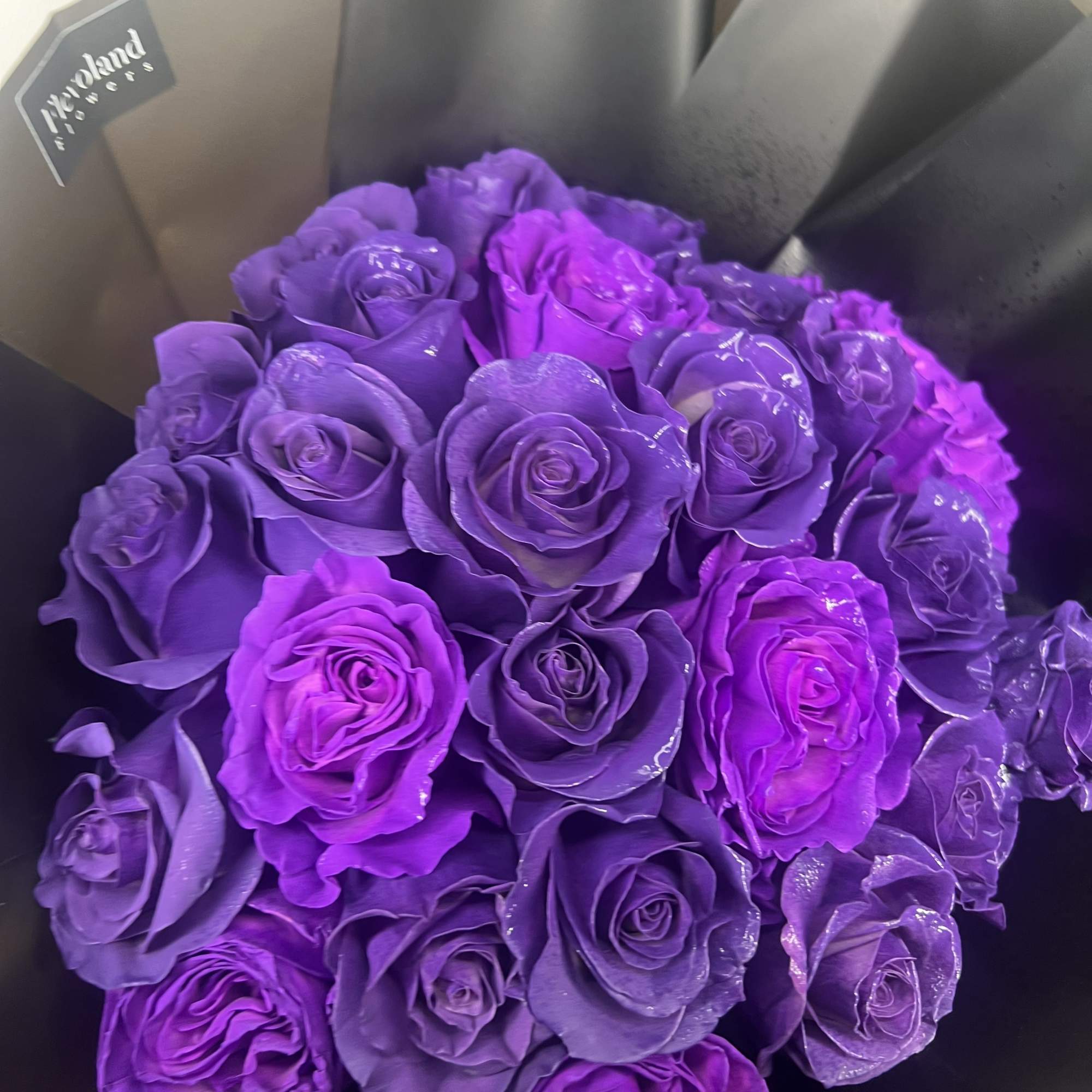 A bouquet of deep purple roses that exudes sophistication and charm. Each