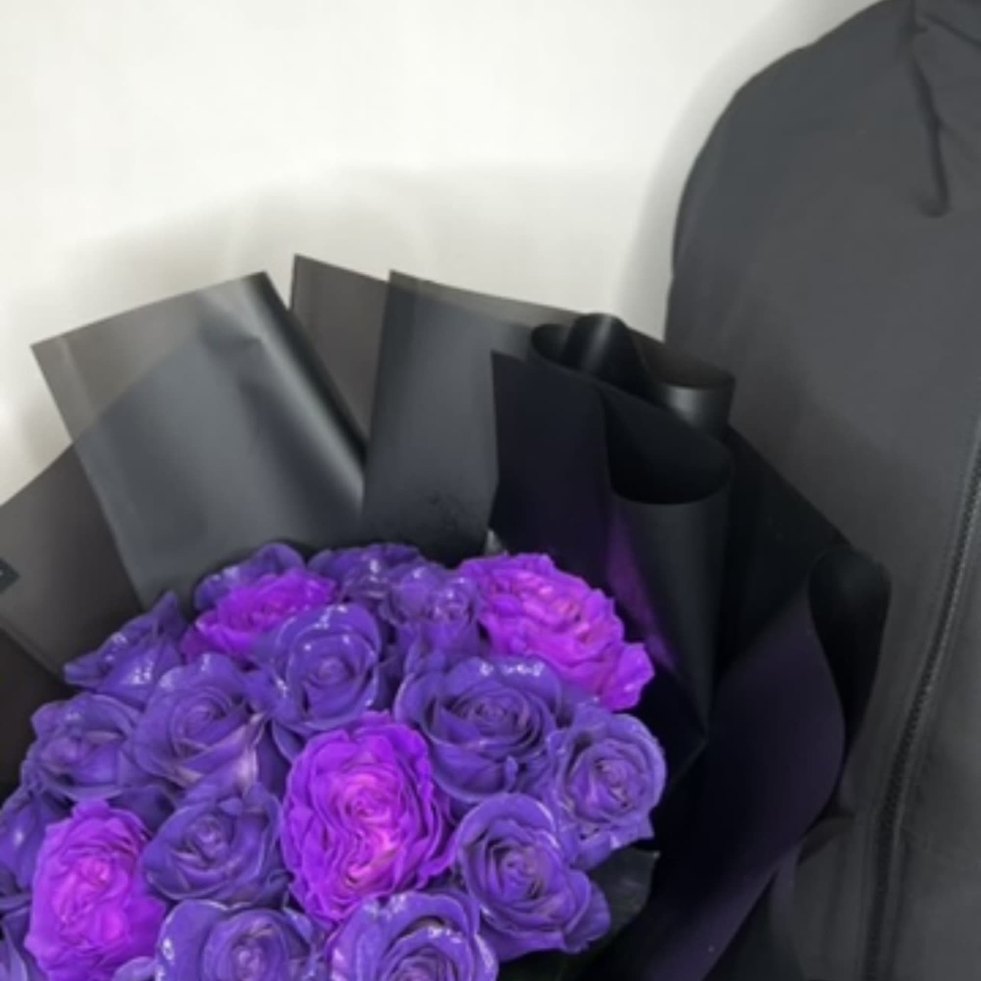 A bouquet of deep purple roses that exudes sophistication and charm. Each