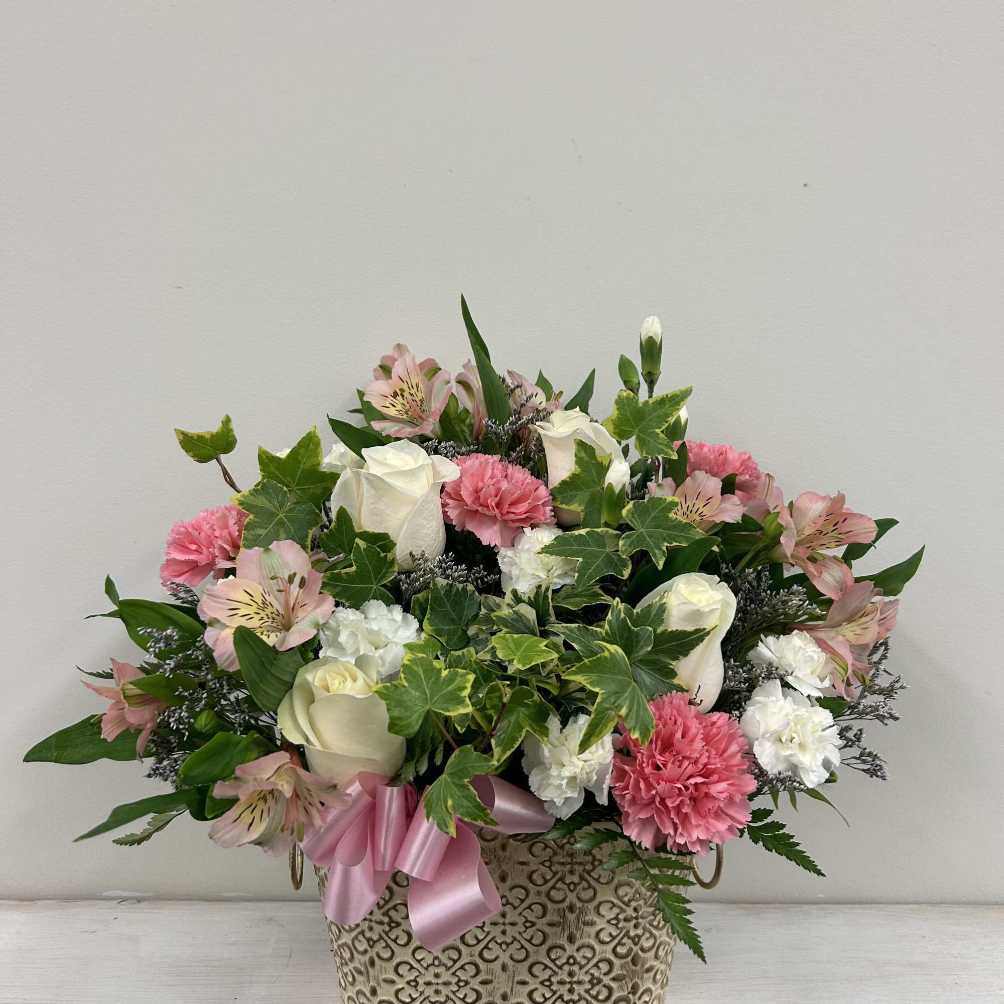Get a pink and white themed arrangement to welcome that new little Get a pink and white themed arrangement to welcome that new little